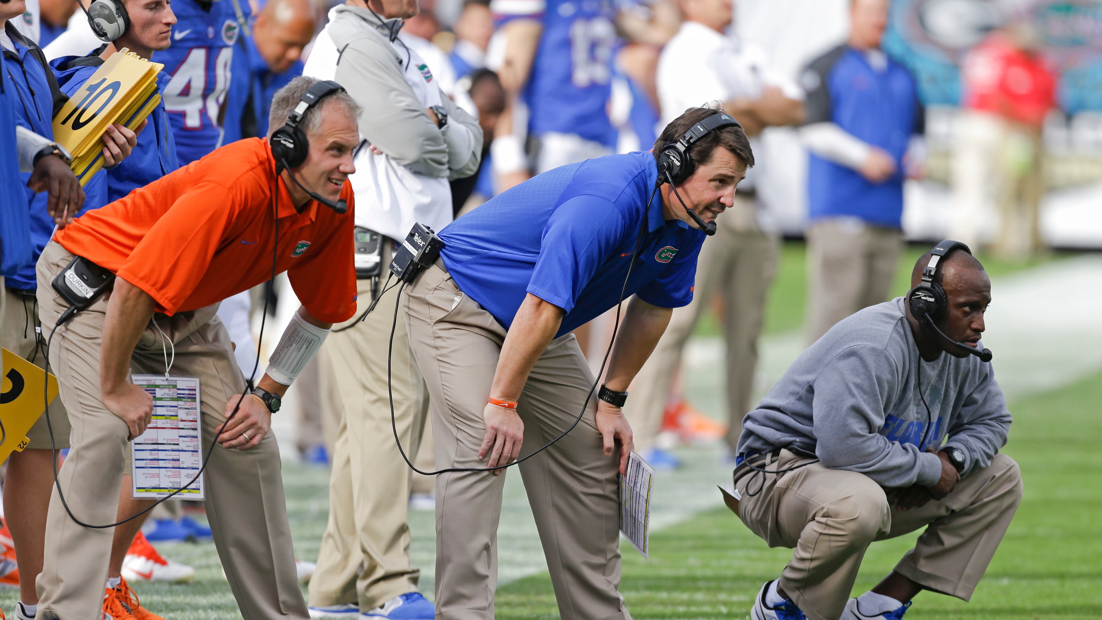 Florida coaches, from left, D.J. Durkin-defensive coordinator, coach Will Muschamp and Travaris Robinson-defensive backs coach watch their team against Georgia during the first half of an NCAA college football game in Jacksonville, Fla., Saturday, Nov. 2, 2013.(AP Photo/John Raoux)