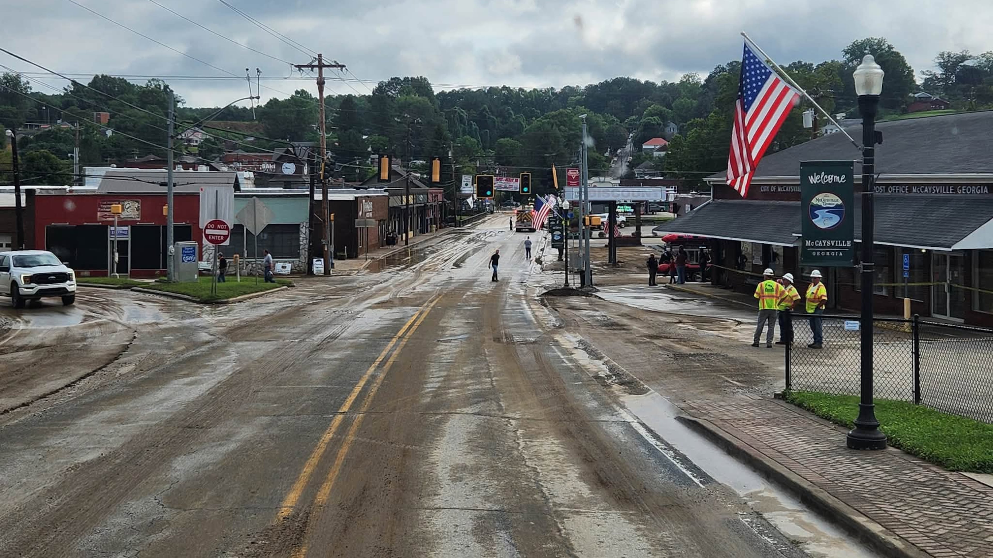 City and county crews and residents in McCaysville clean up streets and repair roads and buildings on Sunday, Aug. 2, 2026, after heavy rainfall overnight led to flooding in the North Georgia small town. (Courtesy of Fannin County Fire Department)