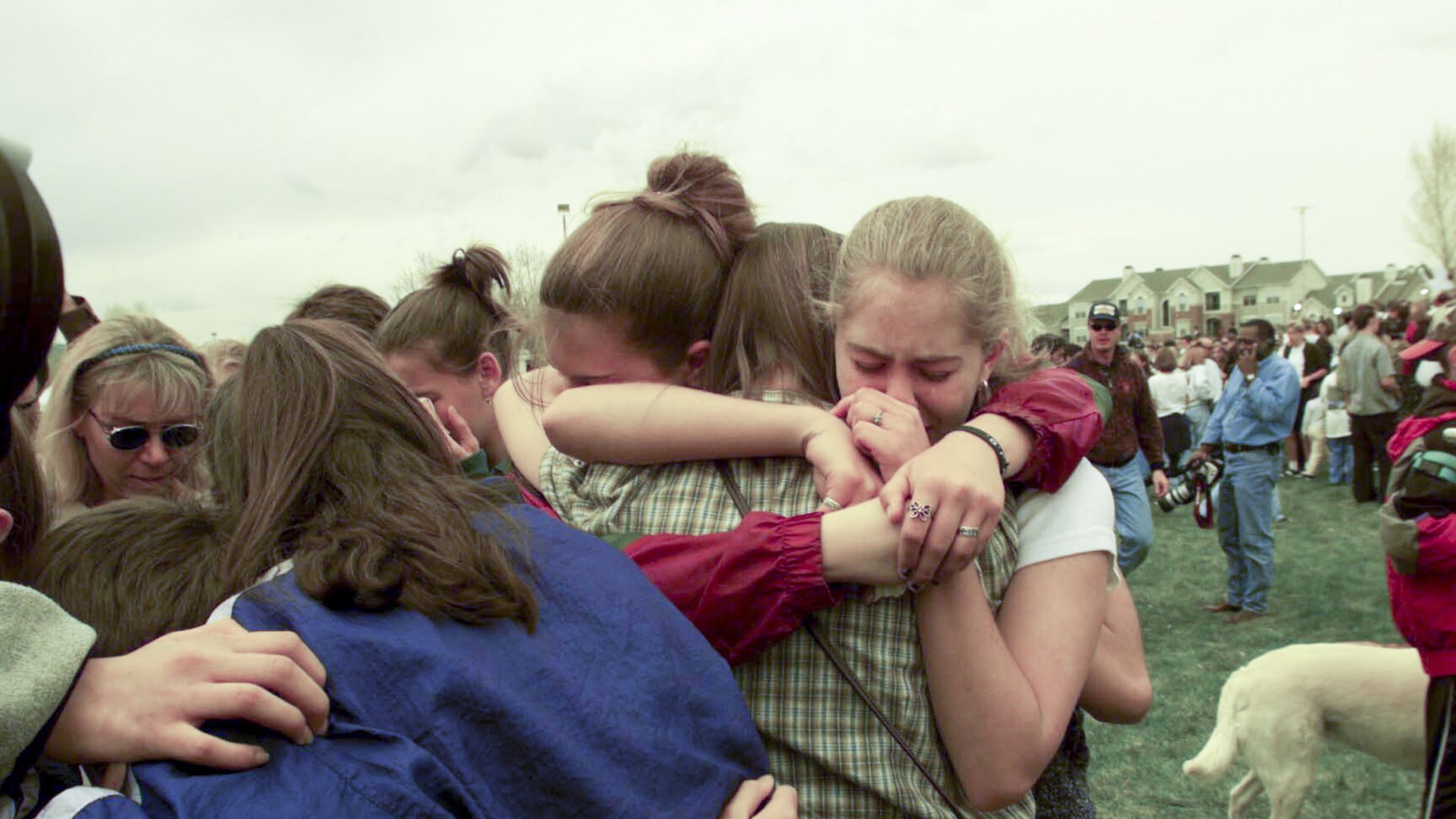 Students the day after the mass shooting at Columbine High School in Littleton, Colo., April 21, 1999. That year, the Columbine High School massacre felt like an earthquake, but as of 2017, it is no longer one of the 10 deadliest mass shootings in postwar America. (Monica Almedia/The New York Times)