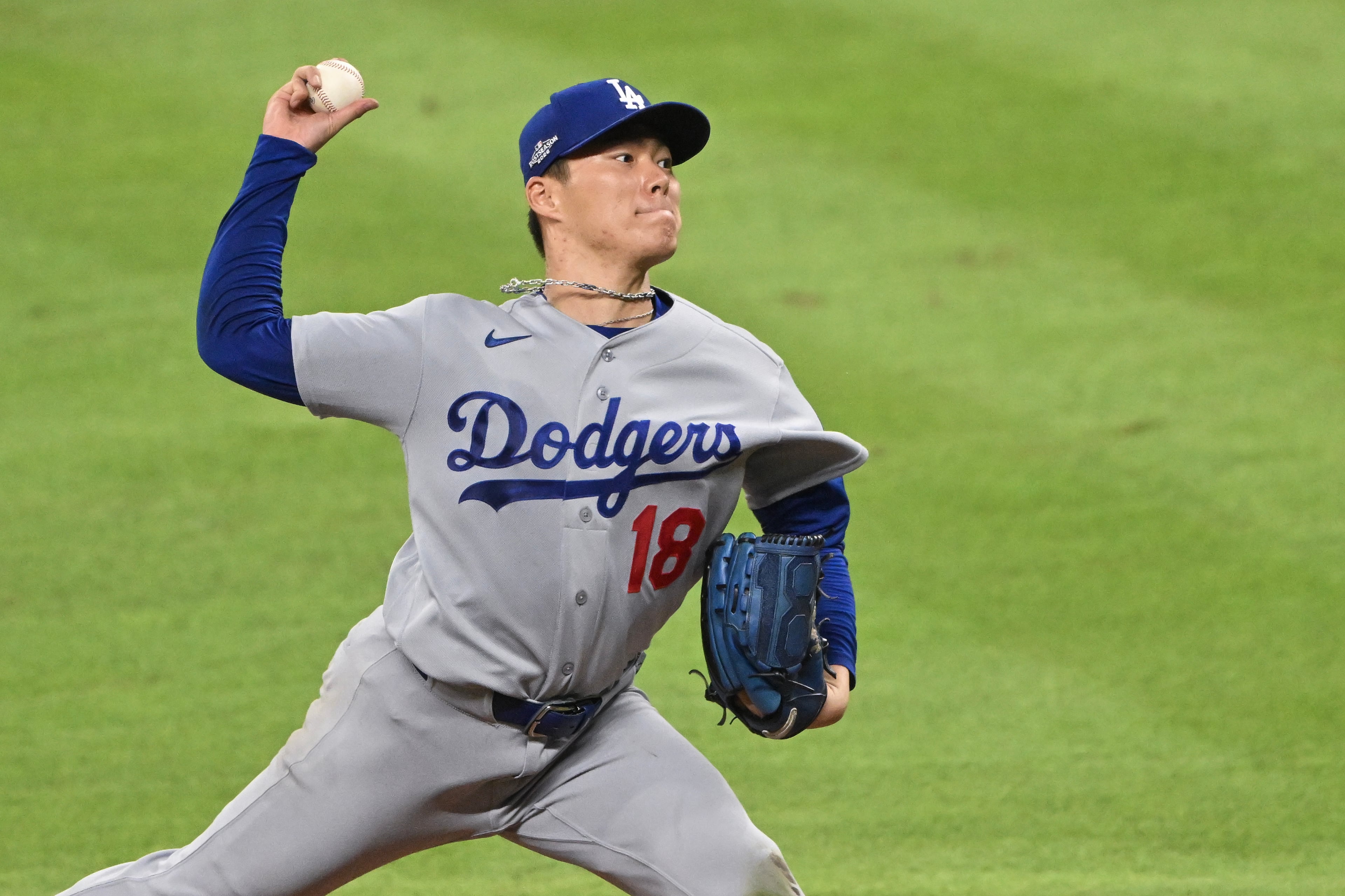 Los Angeles Dodgers pitcher Yoshinobu Yamamoto (18) delivers to an Atlanta Braves batter during the fourth inning of Game 3 of the MLB National League Division Series between the Atlanta Braves and the Los Angeles Dodgers, Tuesday, Oct. 6, 2026, in Atlanta. (Hyosub Shin/AJC)