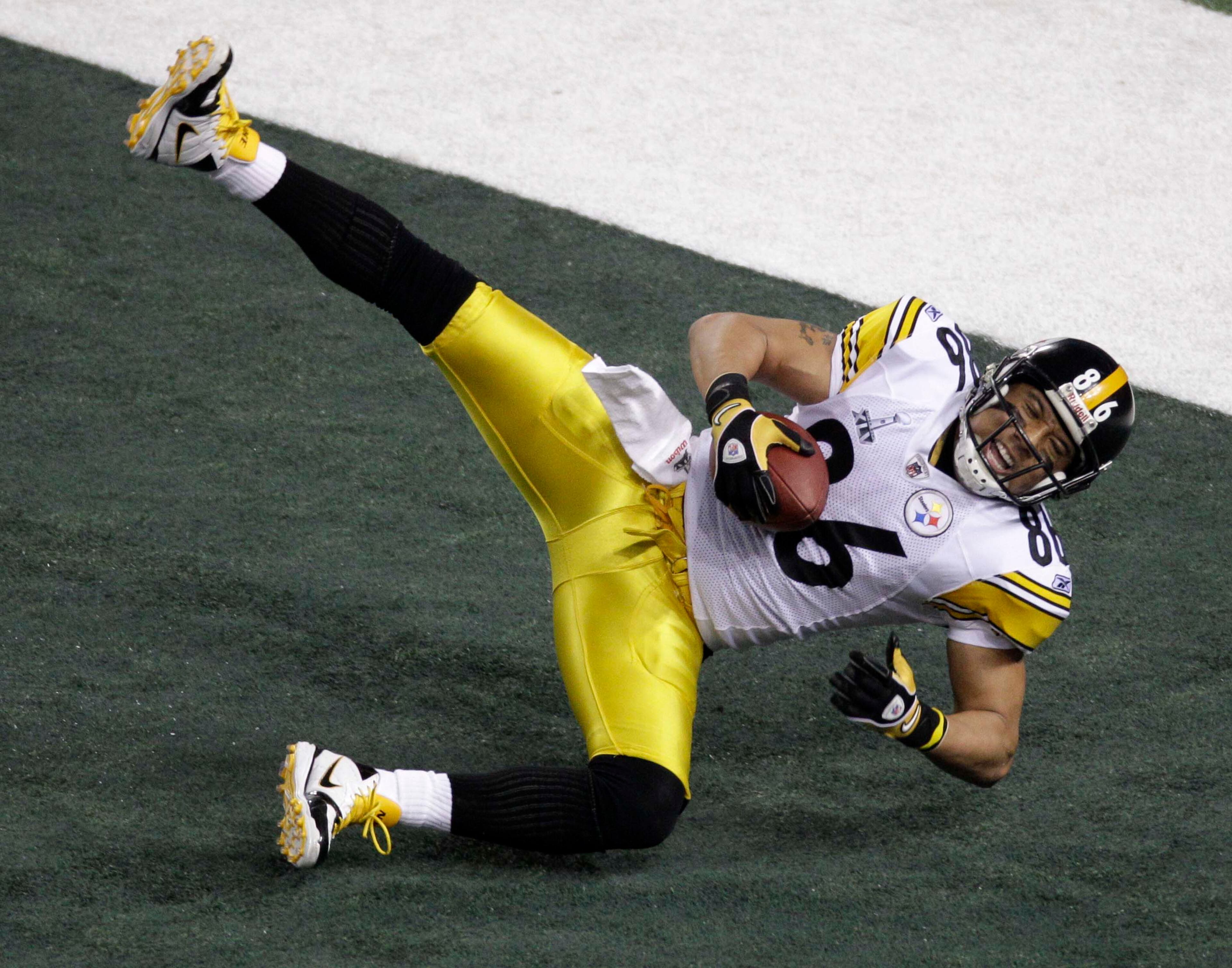 Pittsburgh's Hines Ward comes down with a touchdown reception during the first half.