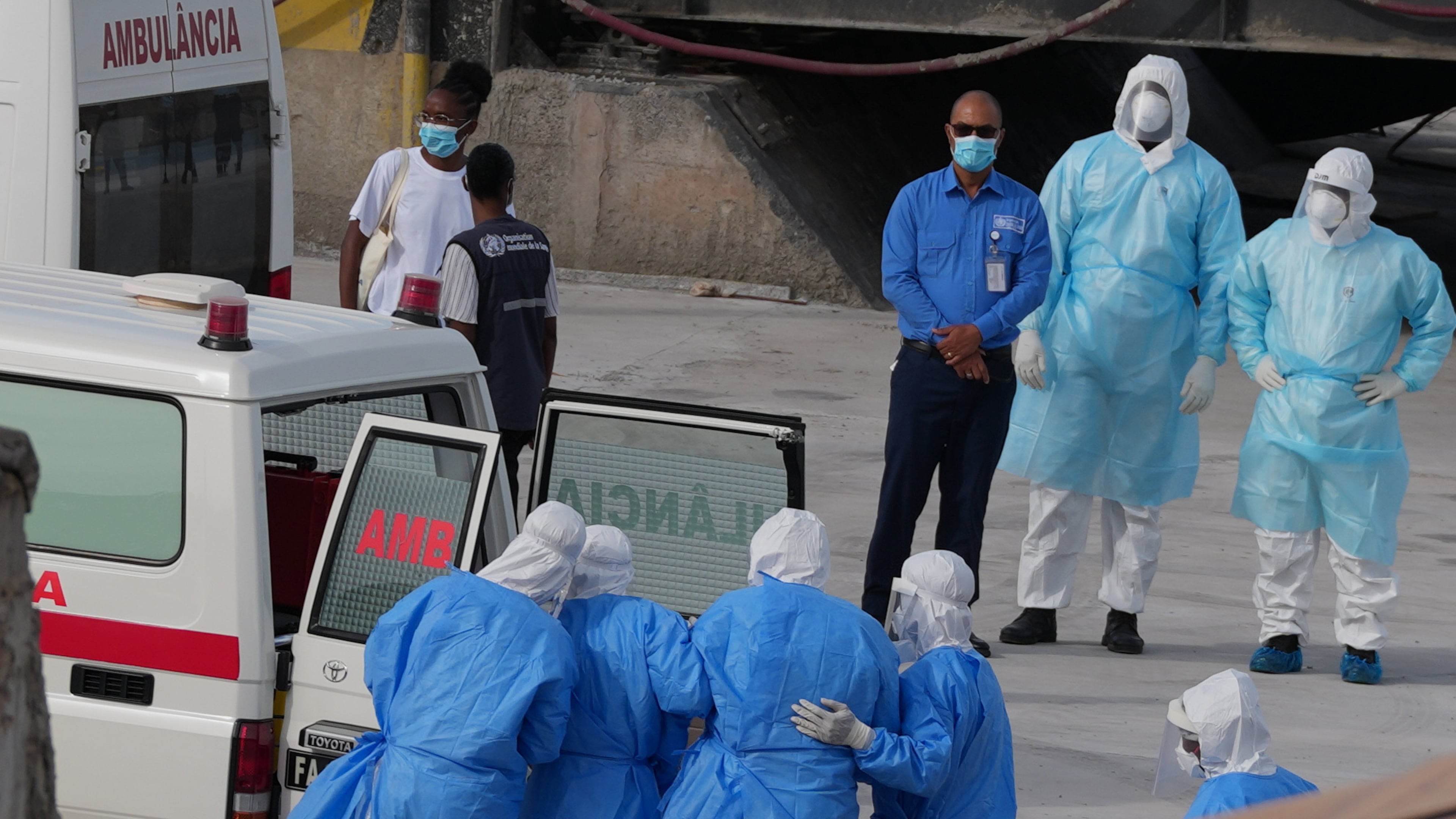 Health workers in protective gear evacuate patients from the MV Hondius cruise ship into an ambulance at a port in Praia, Cape Verde, Wednesday, May 6, 2026. (AP Photo/Misper Apawu)