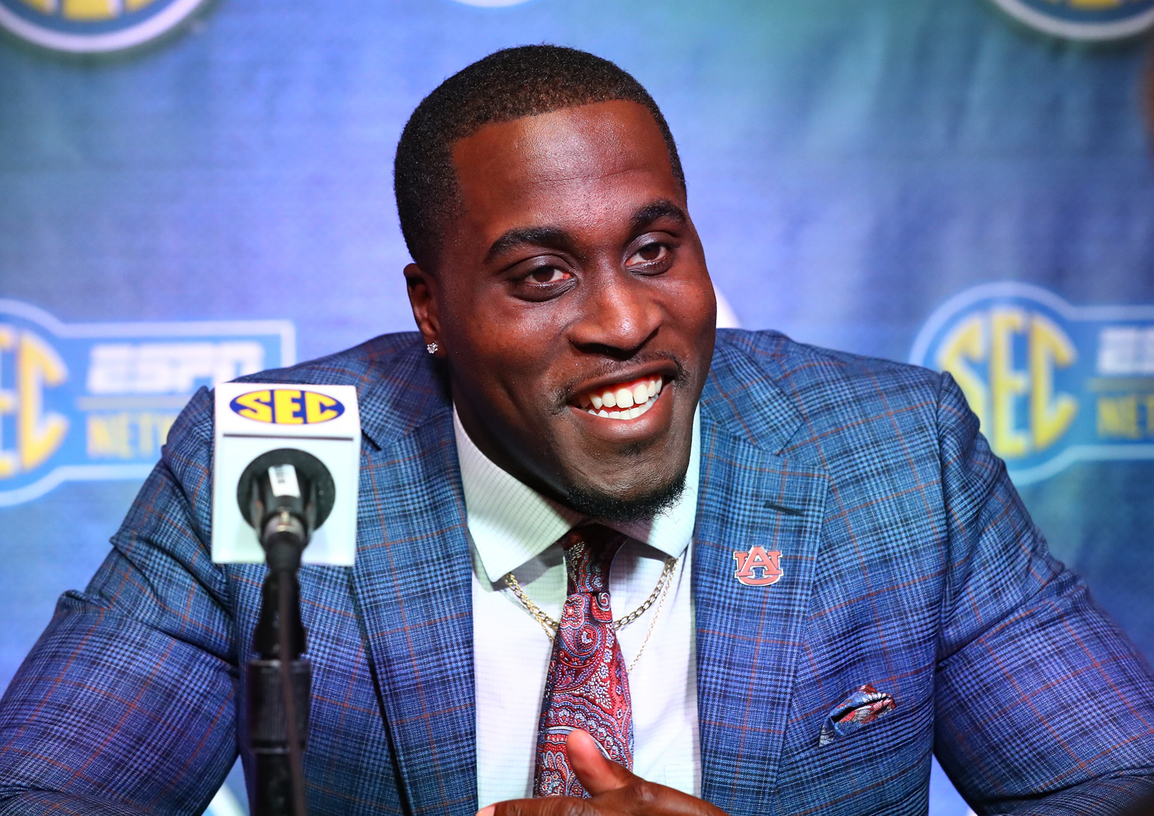 Auburn senior Derick Hall smiles at a question during his press conference at SEC Media Days in the College Football Hall of Fame on Thursday, July 21, 2022, in Atlanta. (Curtis Compton/ccompton@ajc.com)