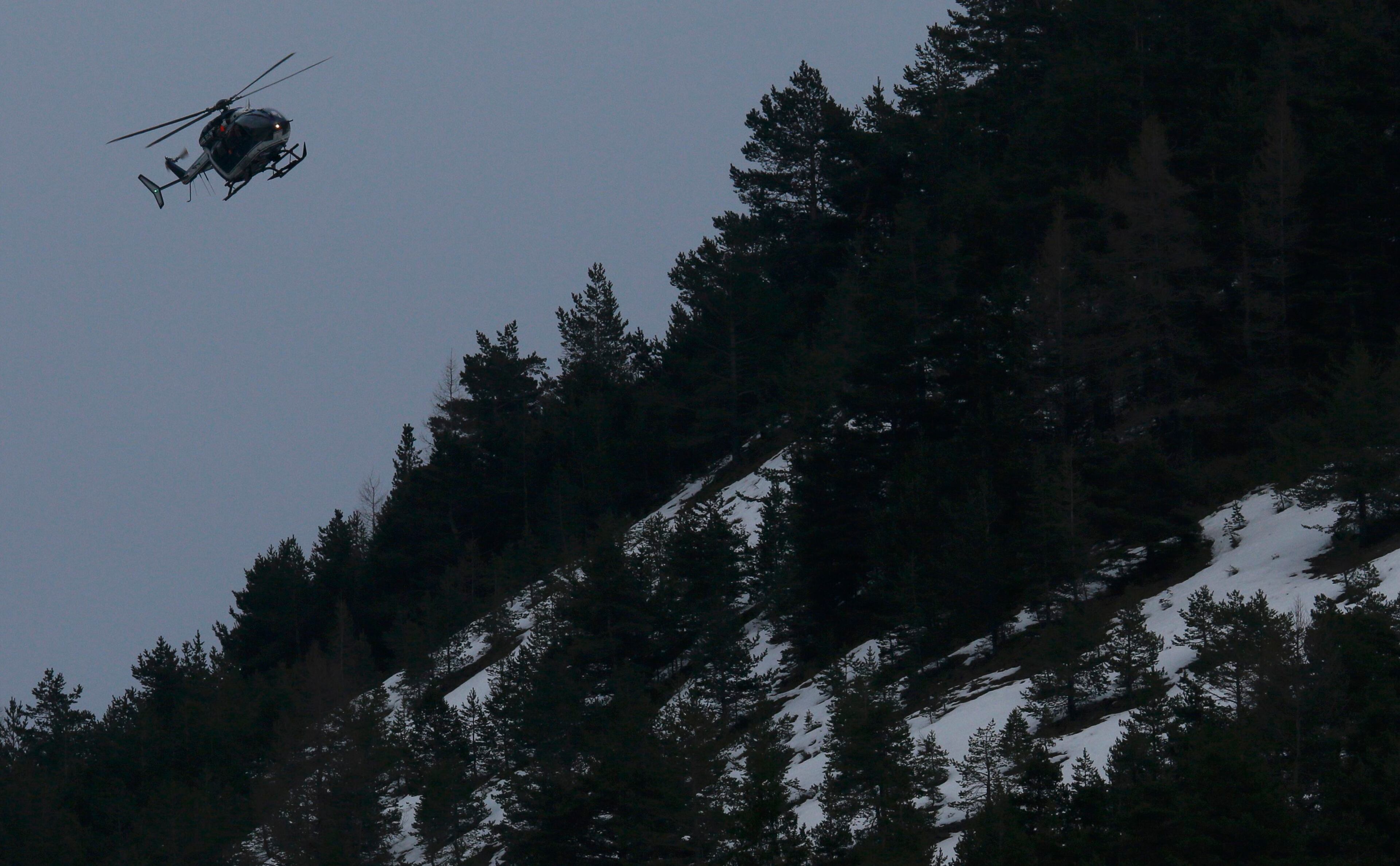 A rescue helicopter from the French Gendarmerie flies over the French Alps during a rescue operation near to the crash site of an Airbus A320, near Seyne-les-Alpes, March 24, 2015. An Airbus plane operated by Lufthansa's Germanwings budget airline, en route from Barcelona to Duesseldorf, crashed in a remote snowy area of the French Alps on Tuesday killing all 150 on board including 16 schoolchildren. REUTERS/Robert Pratta