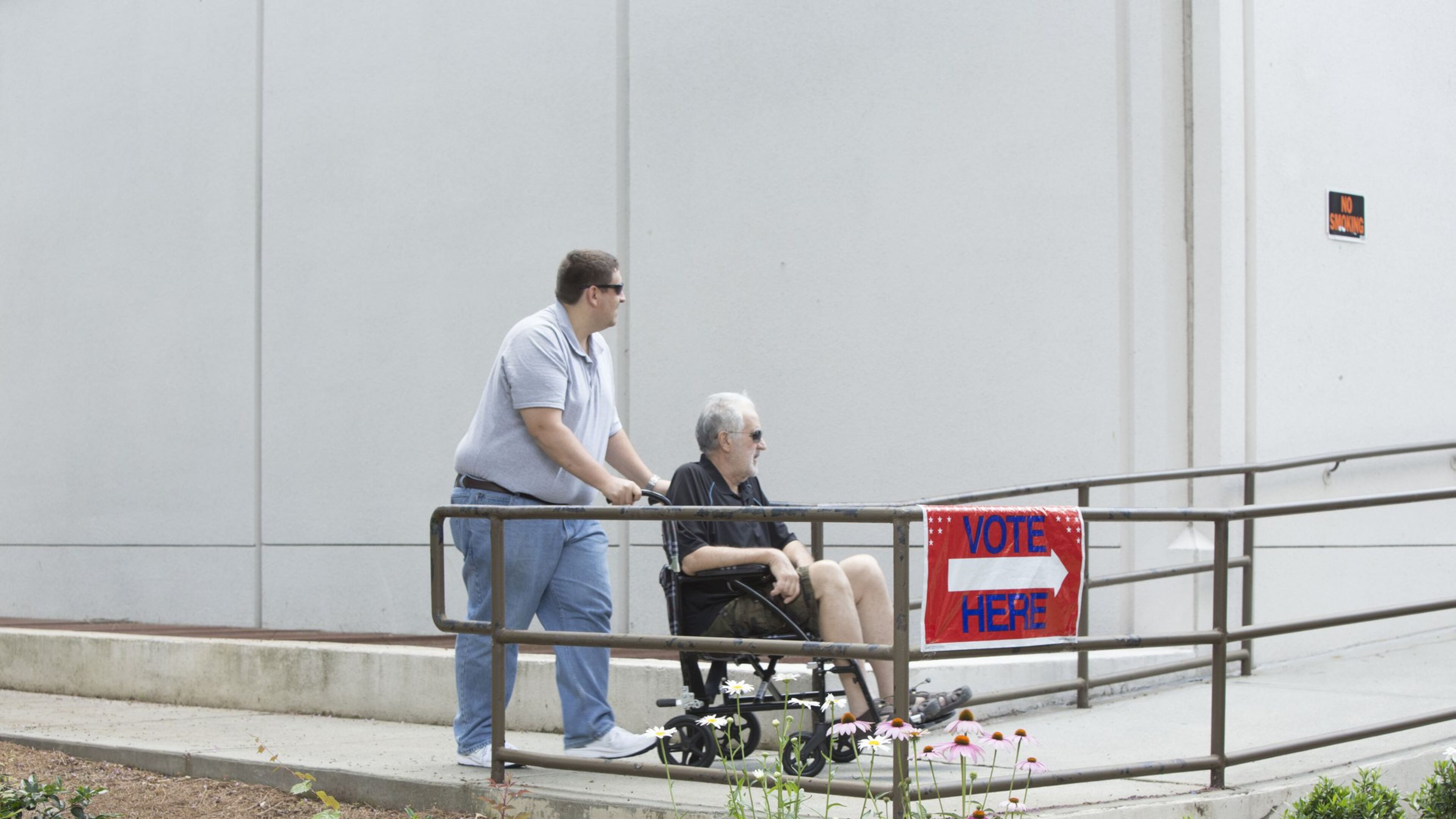 Voters head into a polling location Saturday in north Fulton County ahead of Georgia’s 6th Congressional District runoff scheduled for June 20. CHAD RHYM/AJC