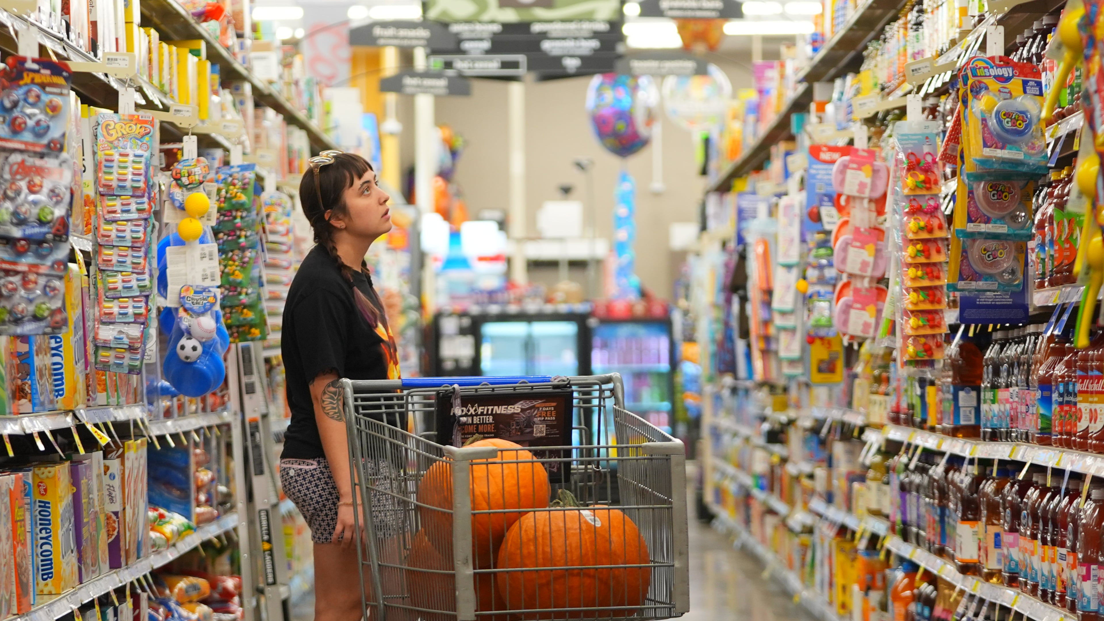 A shopper looks at items in an aisle at a grocery store in Fort Worth, Texas, Wednesday, Oct. 7, 2026. (AP Photo/LM Otero)