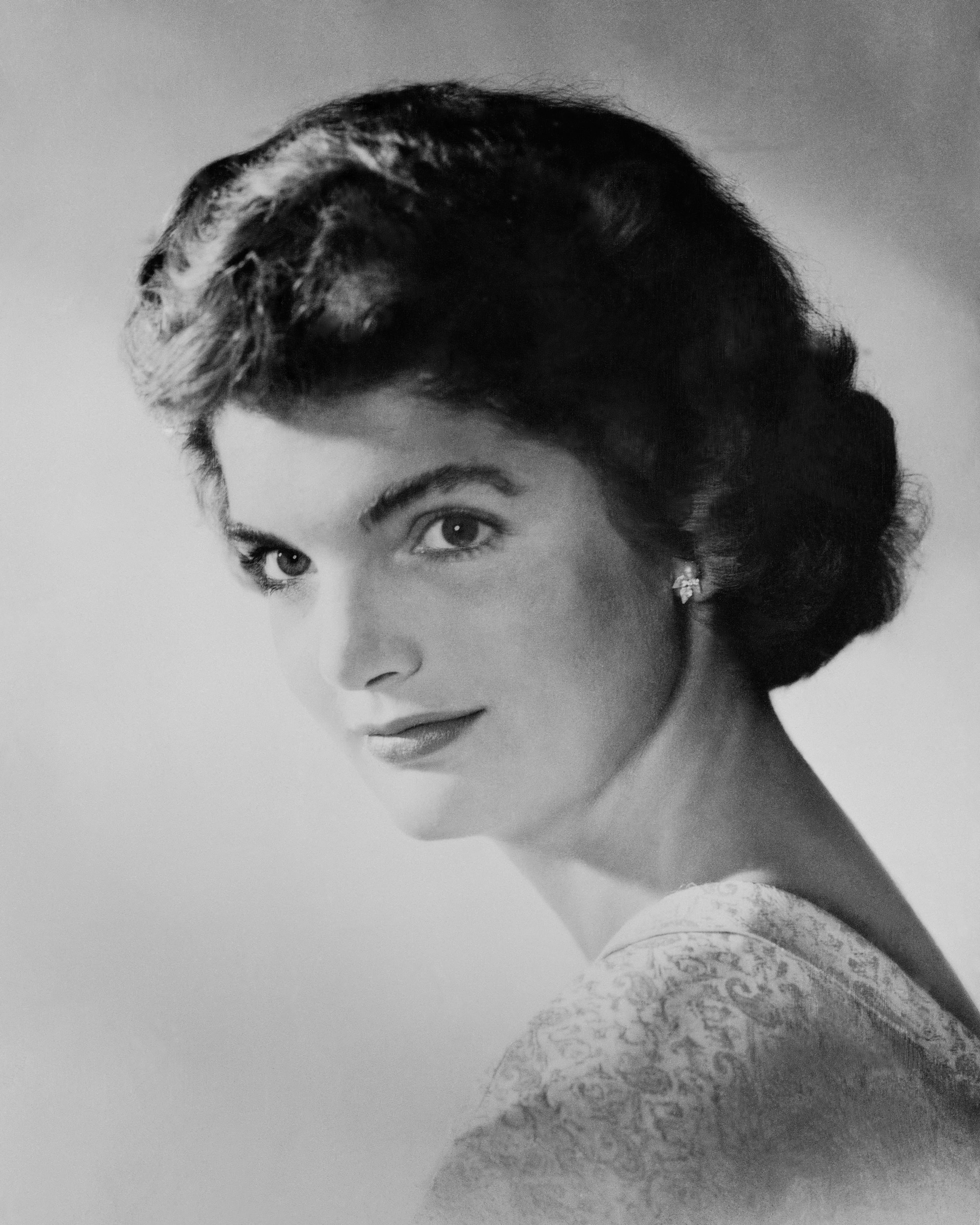 Jacqueline Kennedy Onassis was married to a president and a tycoon, both of whom preceded her in death. Her engagement to U.S. Sen. John F. Kennedy (D-Mass) was announced by her mother and stepfather Mr .and Mrs. Hugh D. Auchincloss of Newport, R.I., June 25, 1953. (AP Photo)