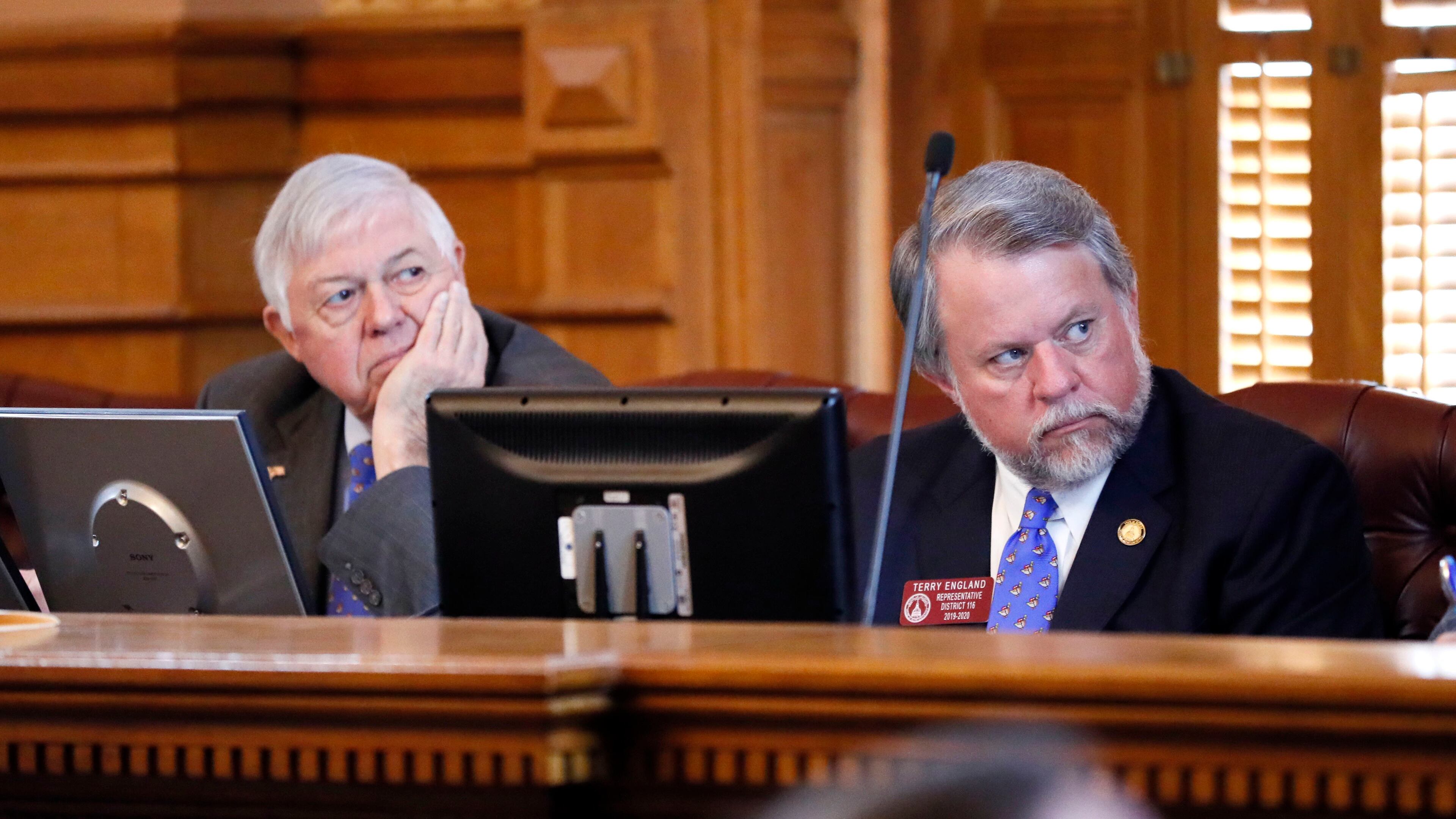 Sen. Jack Hill, R-Reidsville, (left) and Rep. Terry England, R-Auburn, chairmen of the Legislature’s budget committees, listen as Georgia Gov. Brian Kemp talks about his budget plans in 2019. Bob Andres / bandres@ajc.com