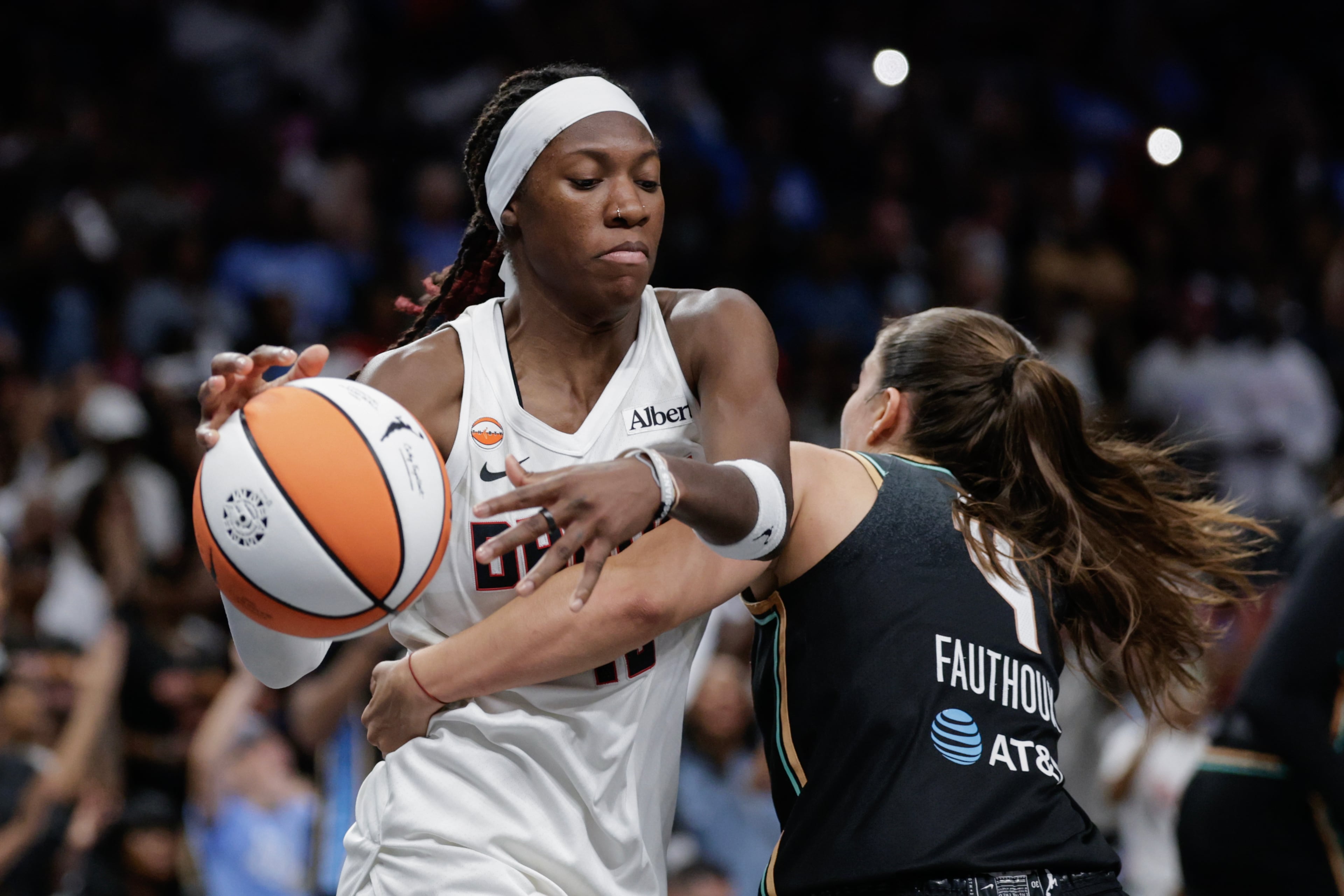 Atlanta Dream guard Rhyne Howard (10) takes a rebound away from New York Liberty guard Marine Fauthoux (4) during the second half of a WNBA semifinal playoff game 1 between the Atlanta Dream and the New York Liberty, Sunday, Oct. 4, 2026, in Atlanta. (Erik S. Lesser for the AJC)