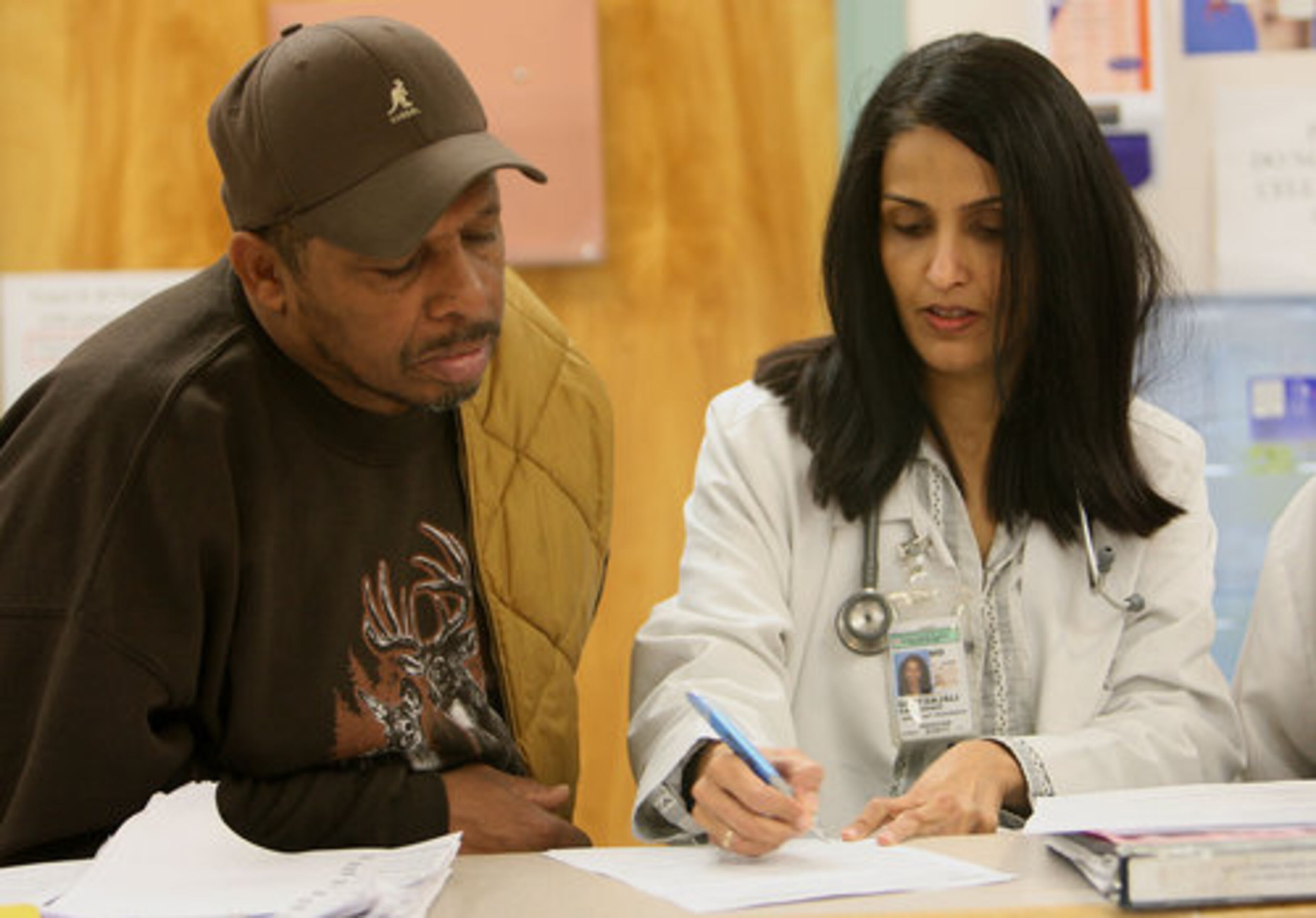 Dr. Geetanjali Vasandani attends to patient Joe Frazier at the Otis W. Smith Health Center on Martin Luther King, Jr. Drive in Atlanta Monday, March 7, 2011.