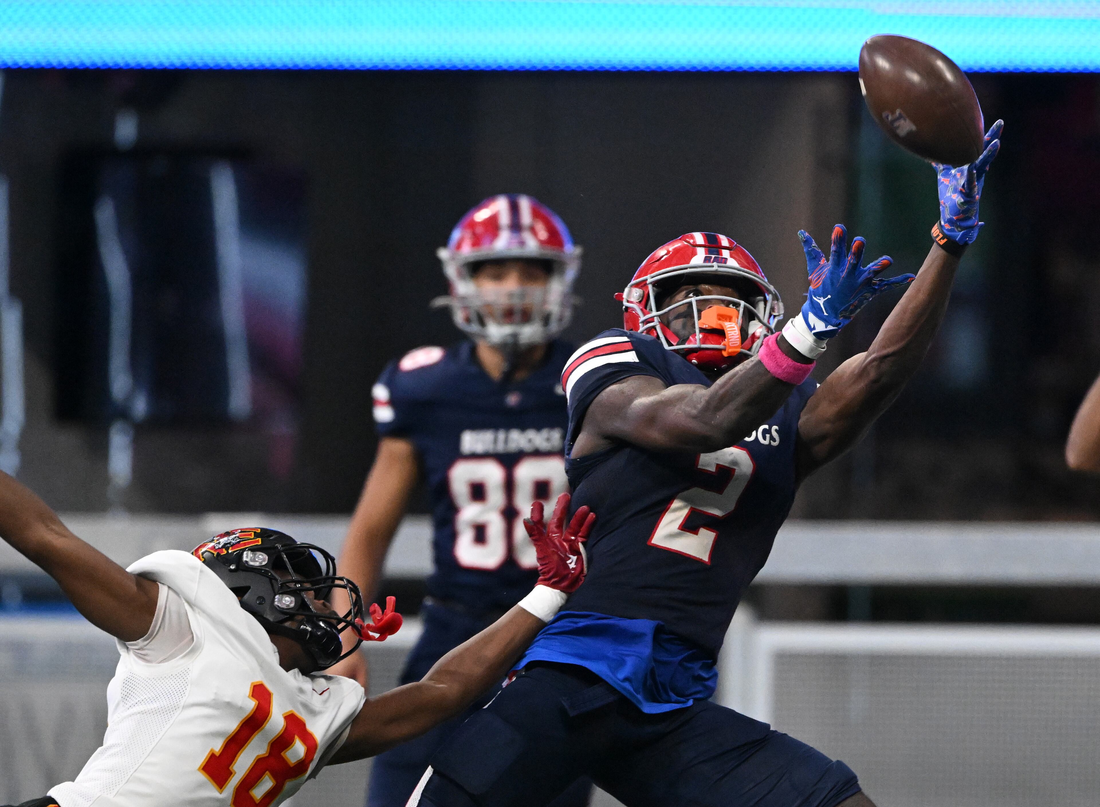 Toombs County's wide receiver Lagonza Hayward (2) is not able to catch under pressure from Northeast's cornerback Jarvaris Morgan (18) during the first half in GHSA Class A-Division State Championship game at Mercedes-Benz Stadium, Tuesday, December 17, 2024, in Atlanta. (Hyosub Shin / AJC)