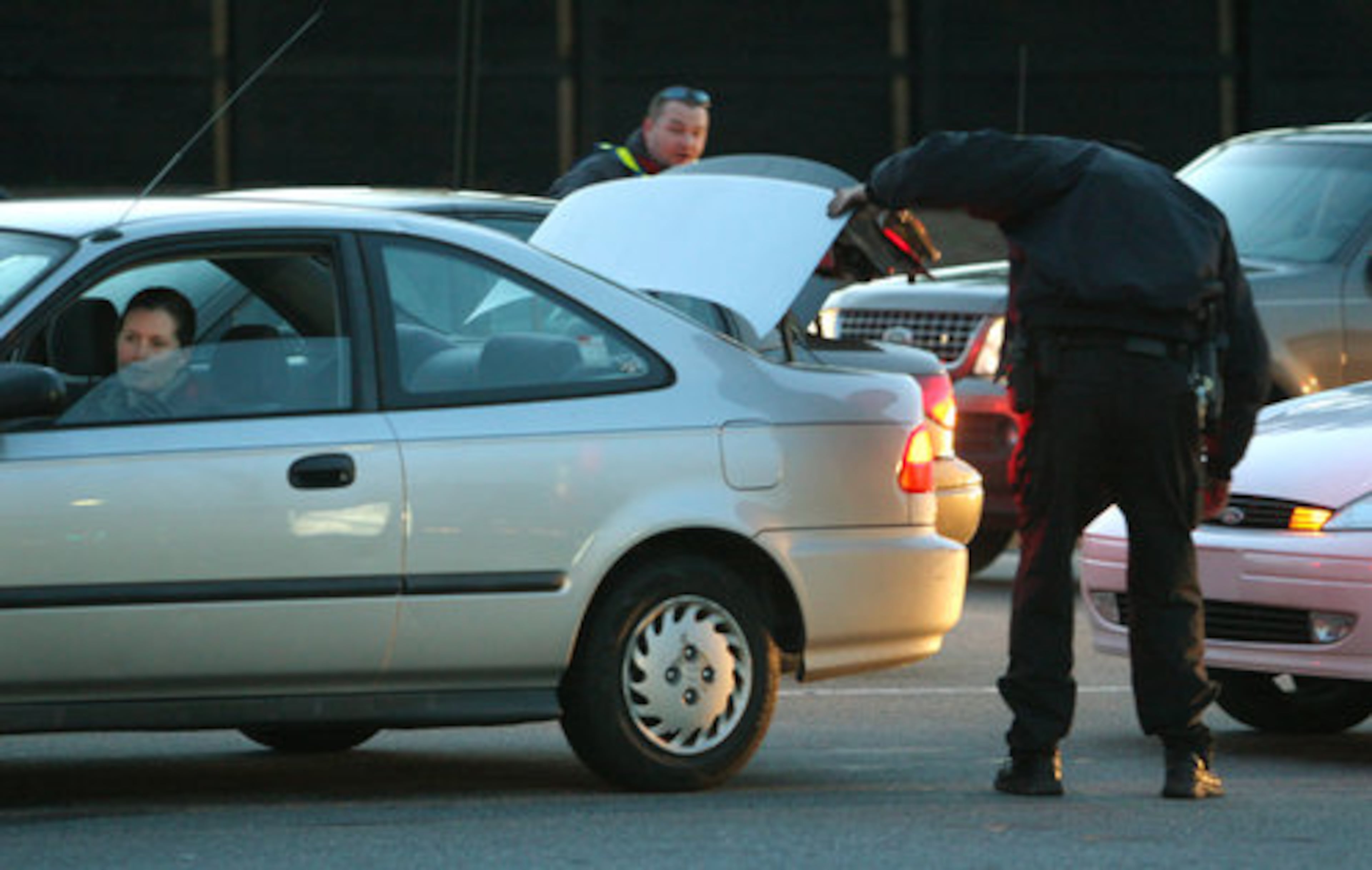 Police search vehicles entering or leaving the Kennesaw State University campus, including cars on Frey Road (above) Tuesday.