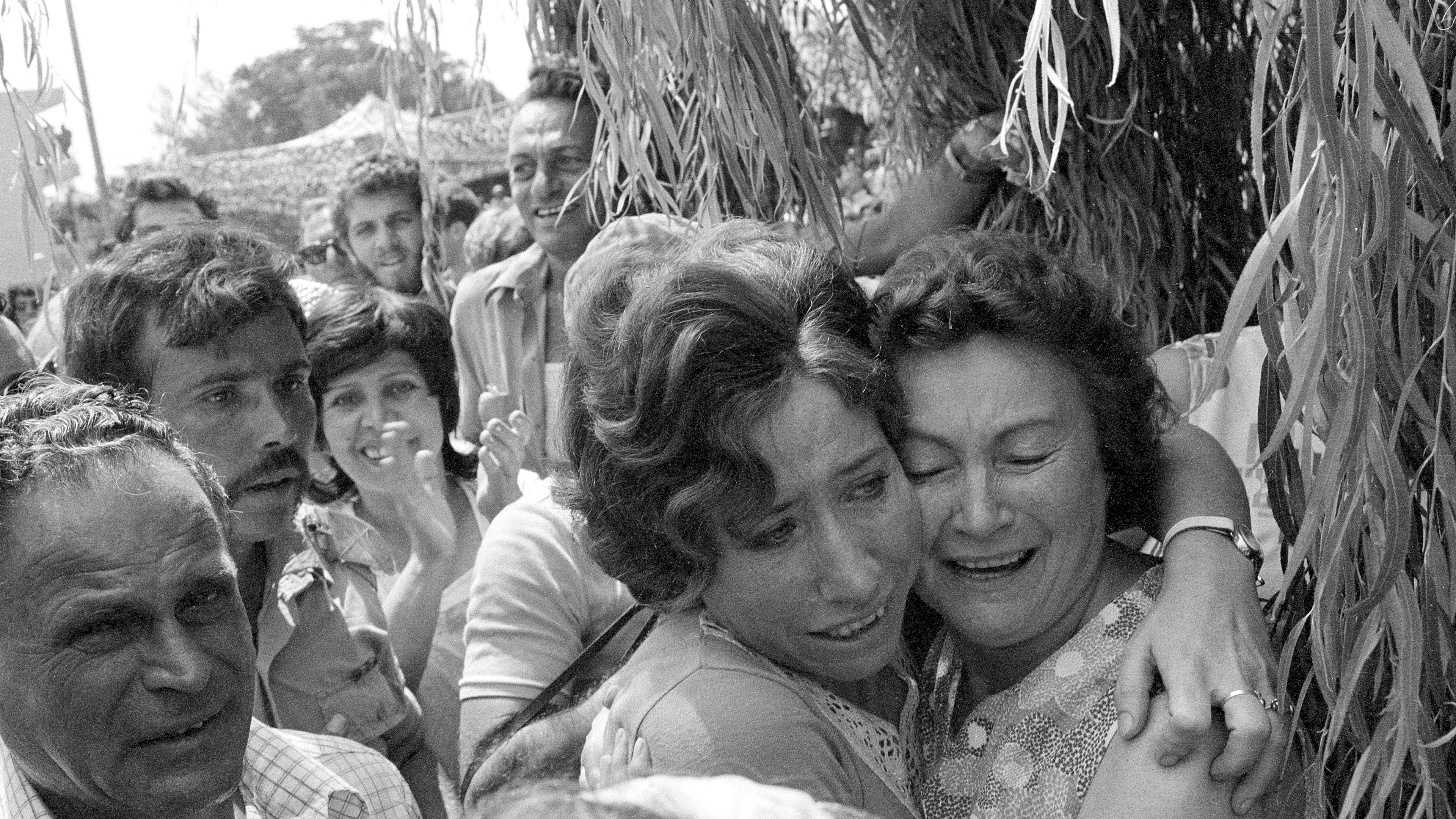 FILE - A mother and her daughter embrace when the latter arrived at Tel Aviv's Ben Gurion Airport after Israeli paratroopers freed her and other hostages aboard a Air France jet at Uganda's Entebbe Airport earlier in the day, July 4, 1976. (AP Photo/Nash, File)