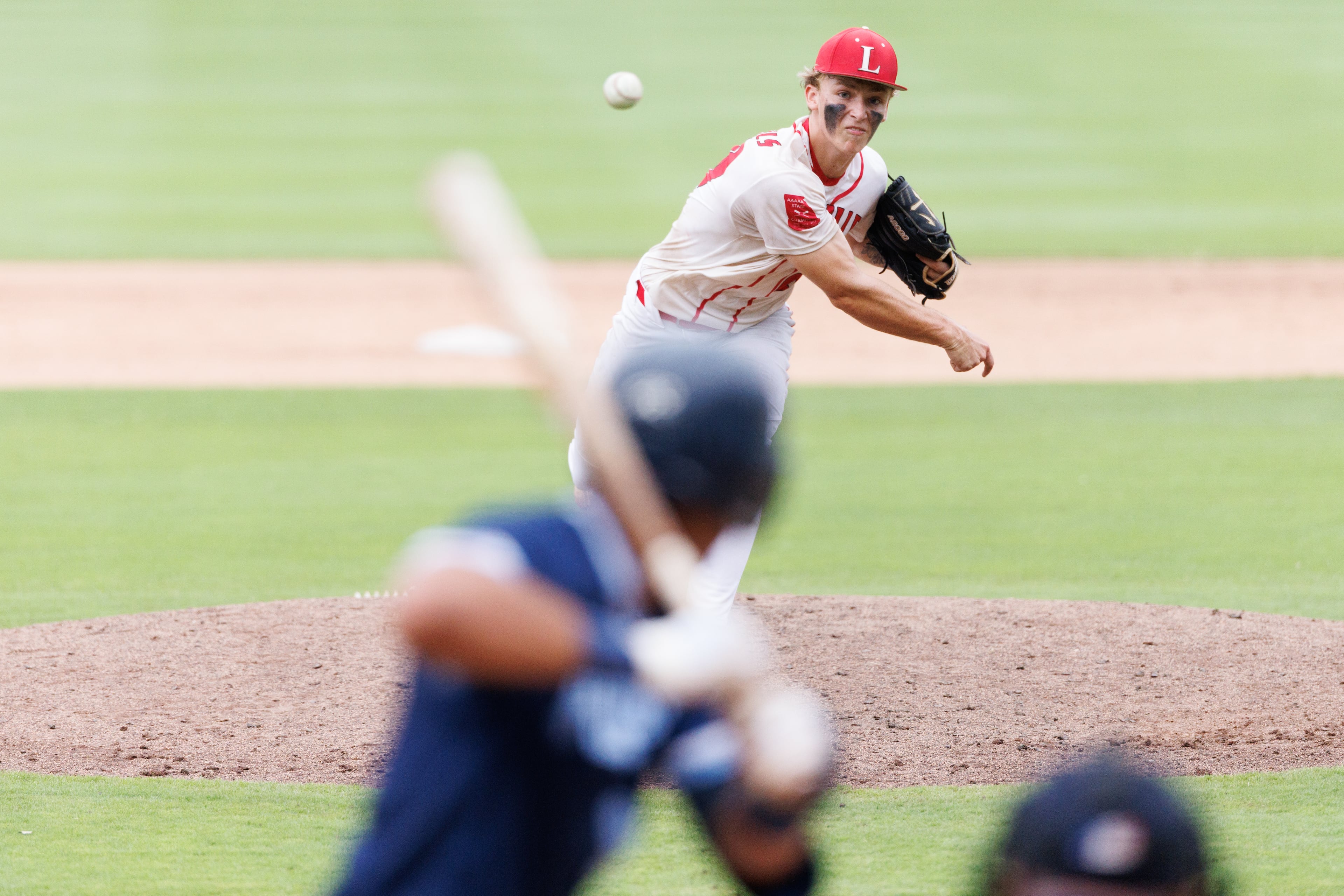 Loganville's Rylan McCoy delivers the ball to a Pope batter during the sixth inning of Game 1 of the GHSA Class 5A baseball state championship series Monday, May 25, 2026, at Gwinnett Field in Lawrenceville. (Estela Muñoz/AJC)