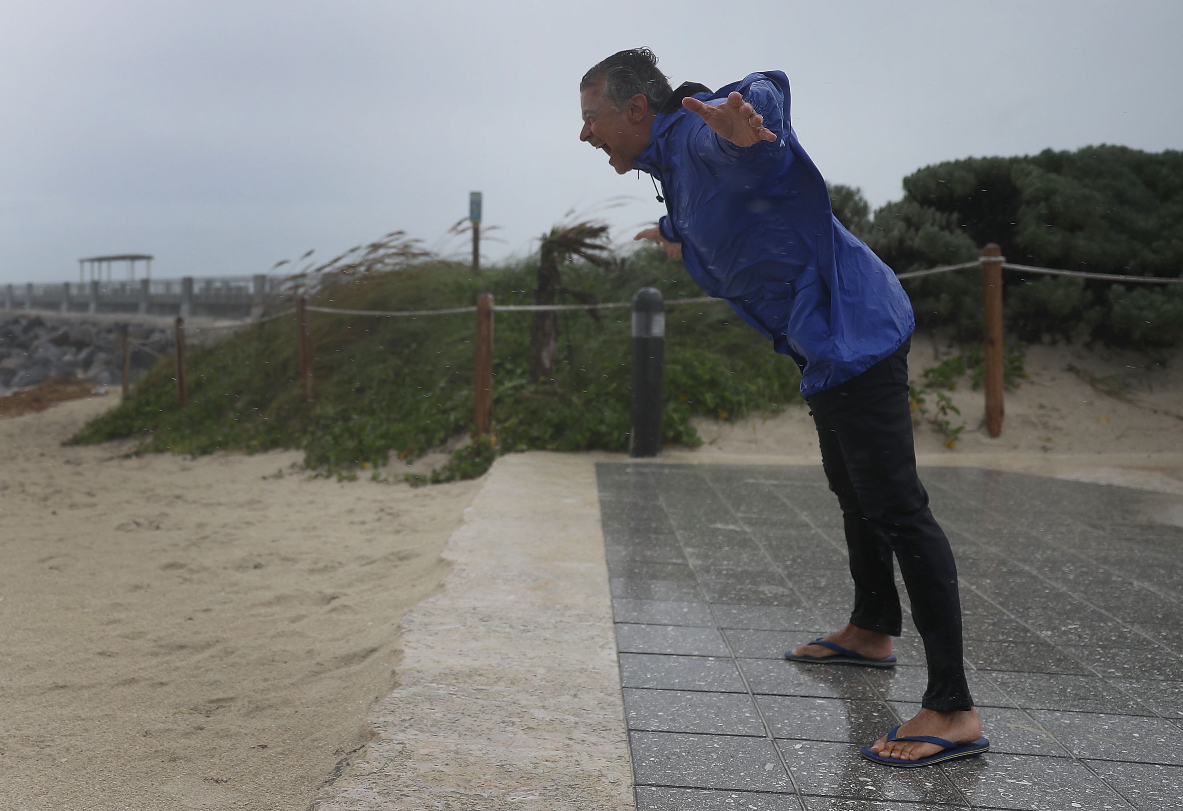MIAMI BEACH, FL - SEPTEMBER 09: Arnold Naintre leans into the winds as Hurricane Irma approaches on September 9, 2017 in Miami Beach, Florida. Florida is in the path of the Hurricane which may come ashore at category 4. (Photo by Joe Raedle/Getty Images)