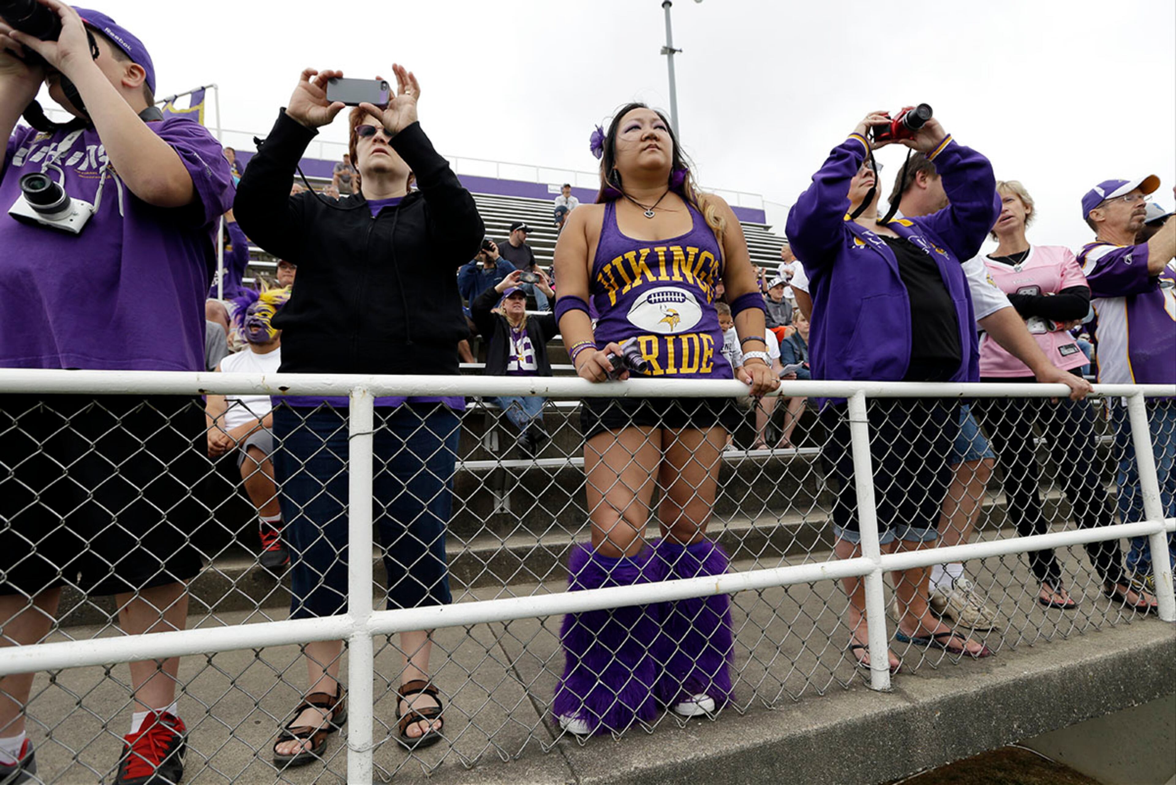 Minnesota Vikings fans look on during training camp in Mankato, Minn.