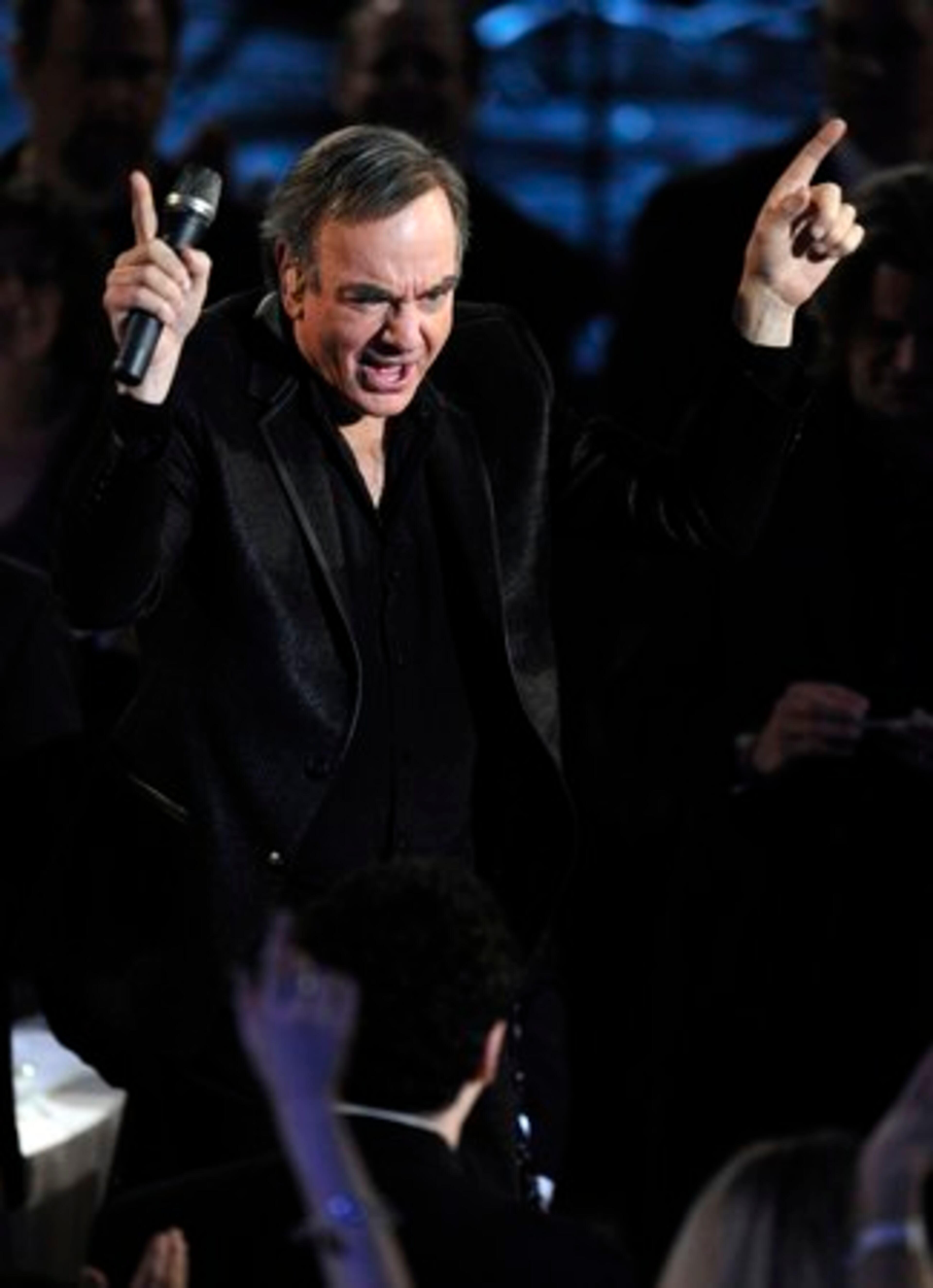 Neil Diamond took the stage last and had the crowd in the glittery ballroom of The Waldorf-Astoria hotel dancing to the 1960s era "Cherry Cherry" well into the four-hour show.