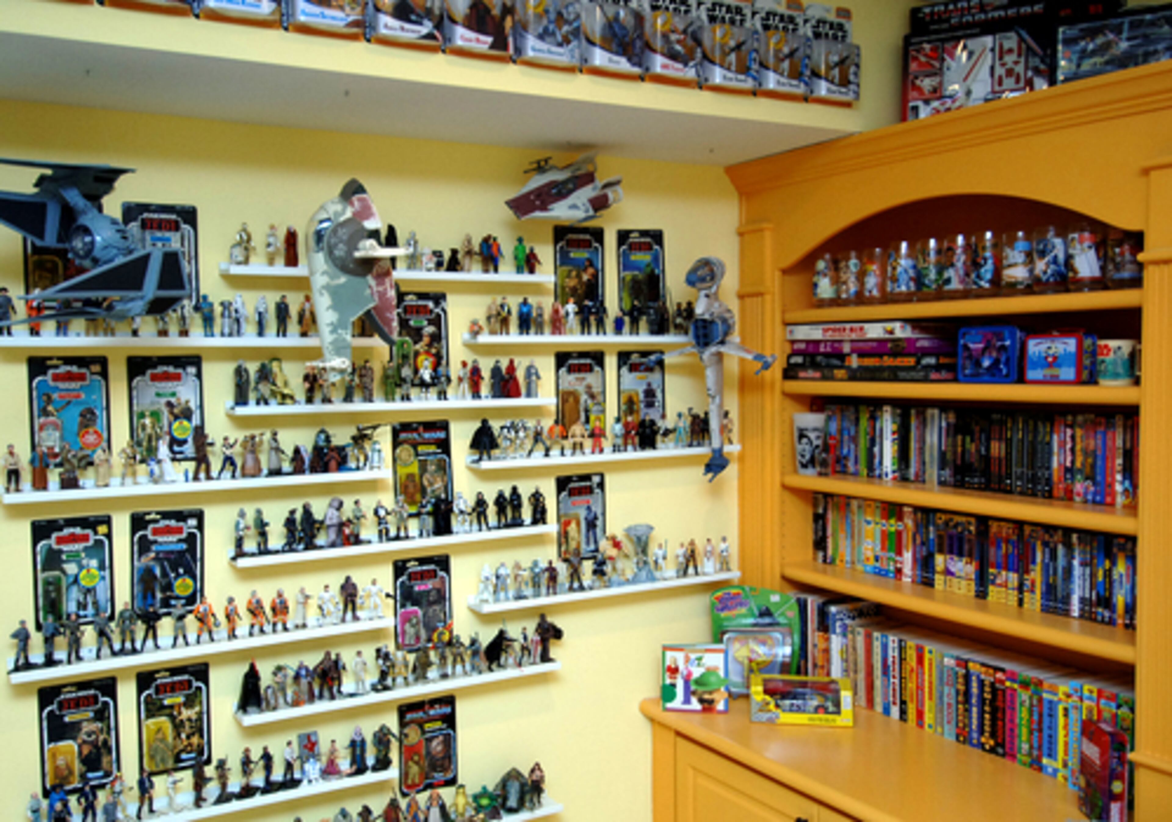 A wall of "Star Wars" figurines and shelves of collectibles are proof of Tor's passion. "I'm just happy it's all in one place," says Dina.