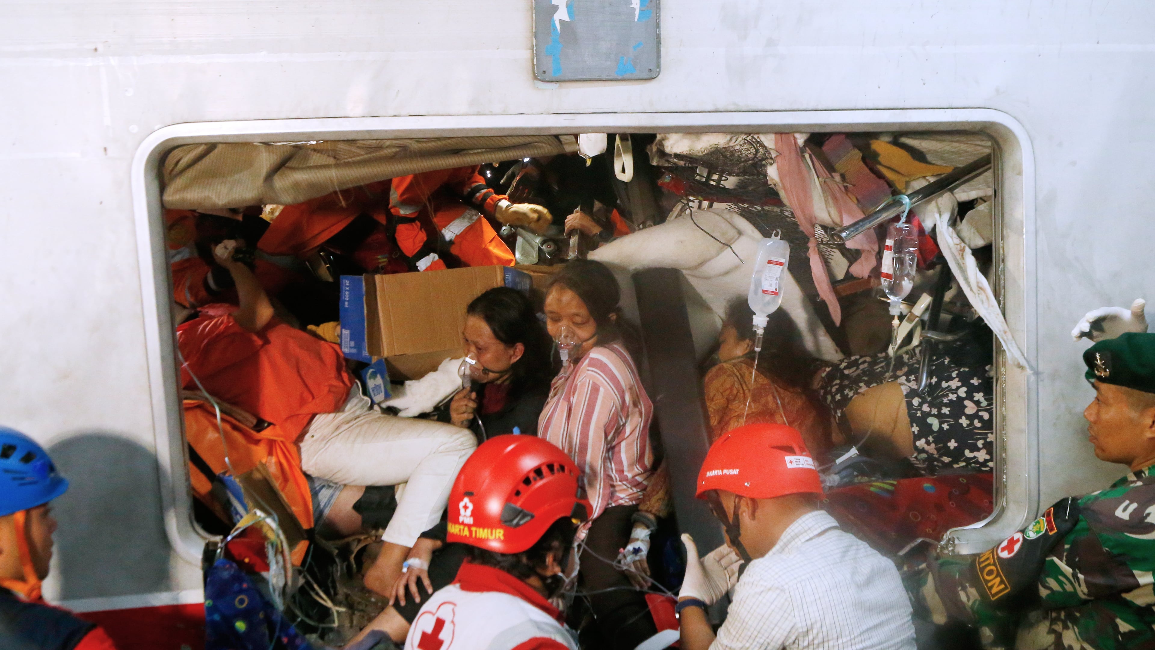 Passengers are being rescued after a train collision in Bekasi, Indonesia, Tuesday, April 28, 2026. (AP Photo)