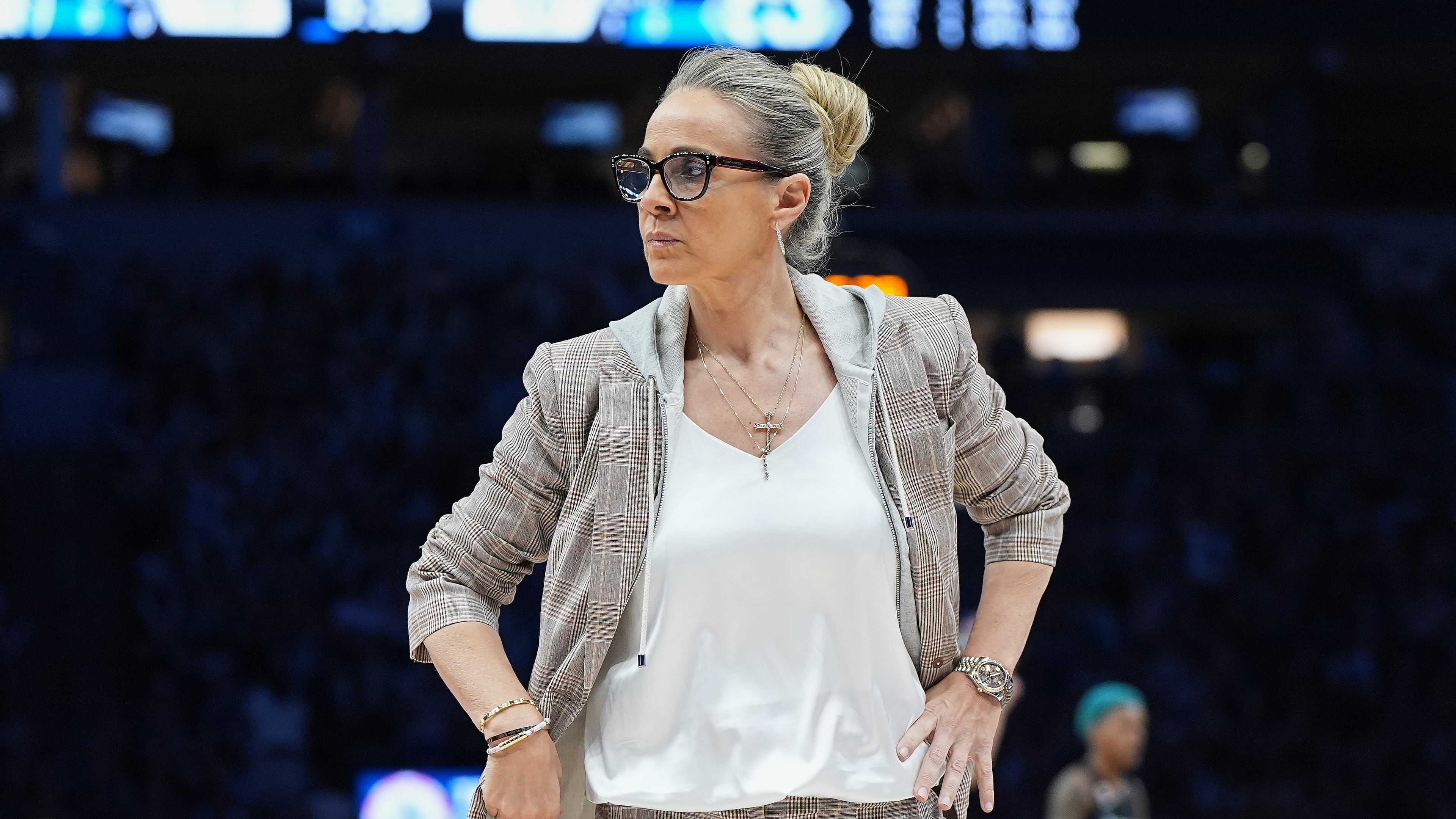 Las Vegas Aces head coach Becky Hammon stands on the court during a timeout in the first half of a WNBA basketball game against the Minnesota Lynx Saturday, Aug. 8, 2026, in Minneapolis. (AP Photo/Abbie Parr)