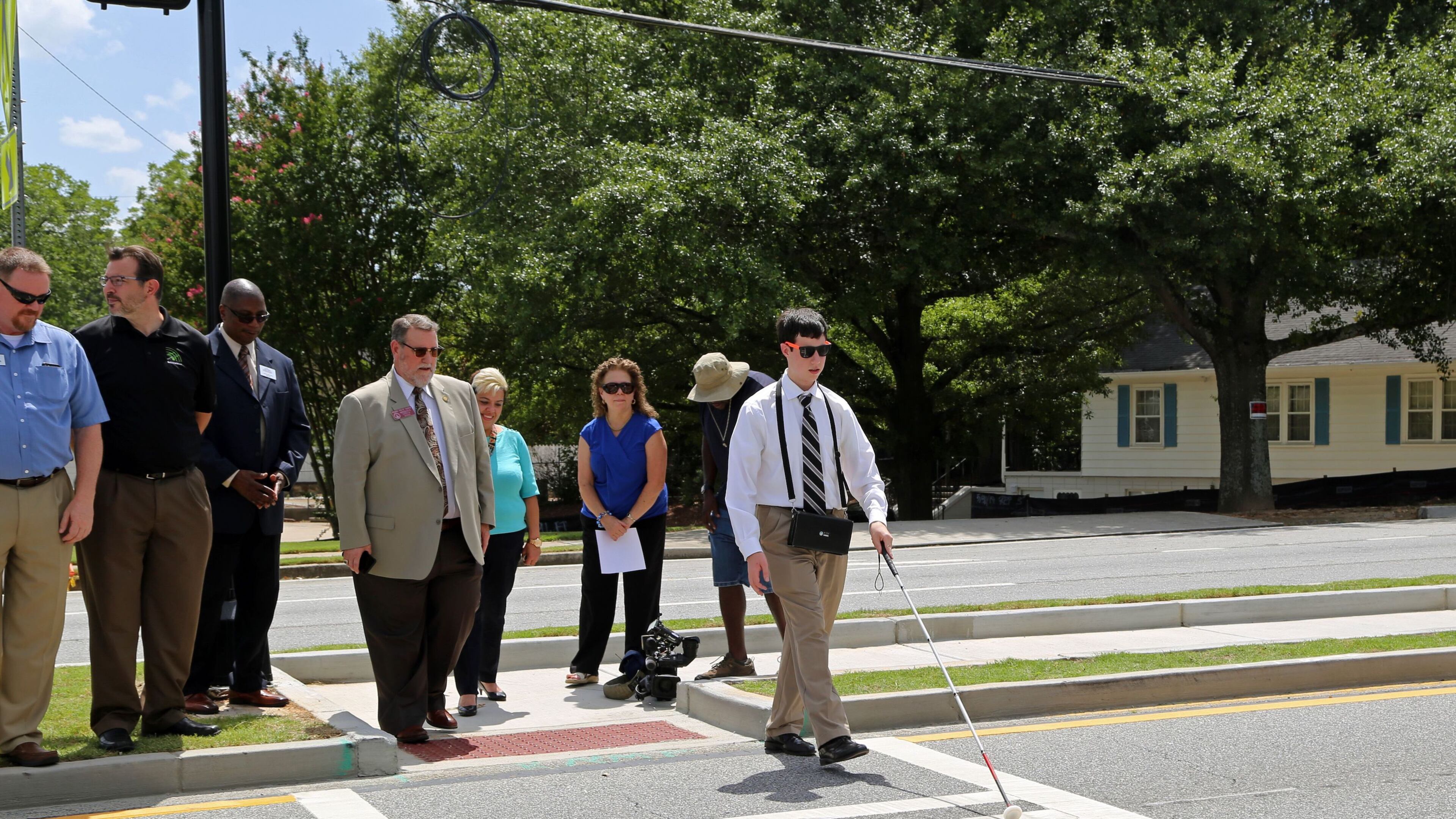 On July 16, Timothy Jones helped open the new Norcross audible HAWK crosswalk by walking across Beaver Ruin Road. (Courtesy A. Brown Olmstead Associates)