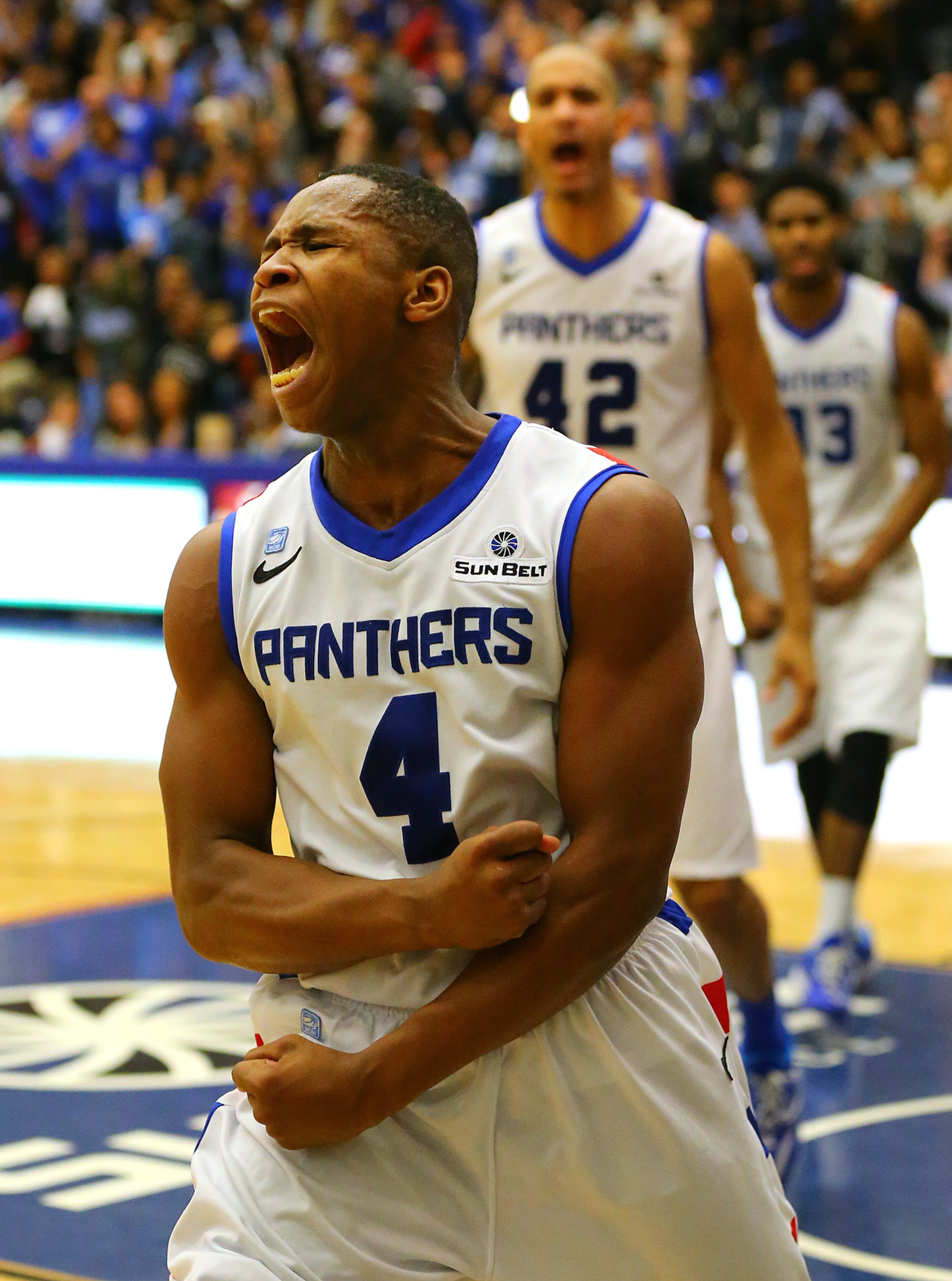 Georgia State guard Isaiah Dennis reacts to scoring and drawing a foul from Georgia Southern in the final minutes on the way to winning the Sun Belt men's basketball regular season championship 72-55 in a basketball game on Saturday, March 7, 2015, in Atlanta.