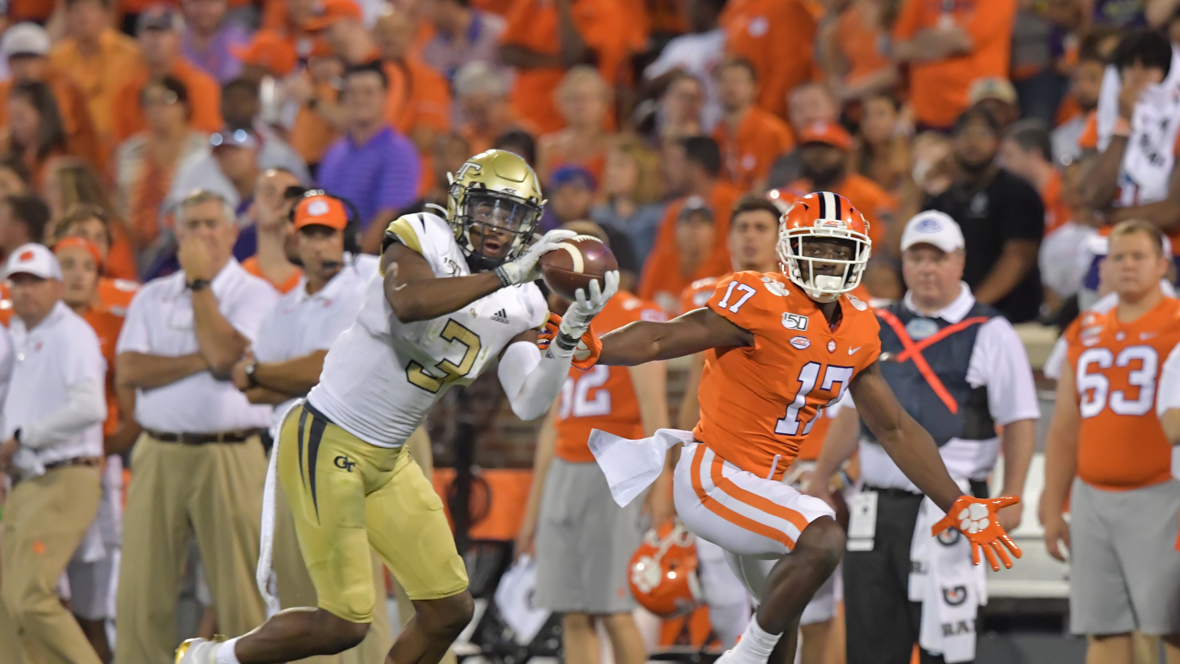 Georgia Tech defensive back Tre Swilling (3) intercepts a pass intended for Clemson wide receiver Cornell Powell (17) and then runs with the ball in the first half at Memorial Stadium on the Clemson University campus in Clemson, S.C. on Thursday, August 29, 2019. Georgia Tech took the field for the first time with Geoff Collins as head coach. (Hyosub Shin / Hyosub.Shin@ajc.com)