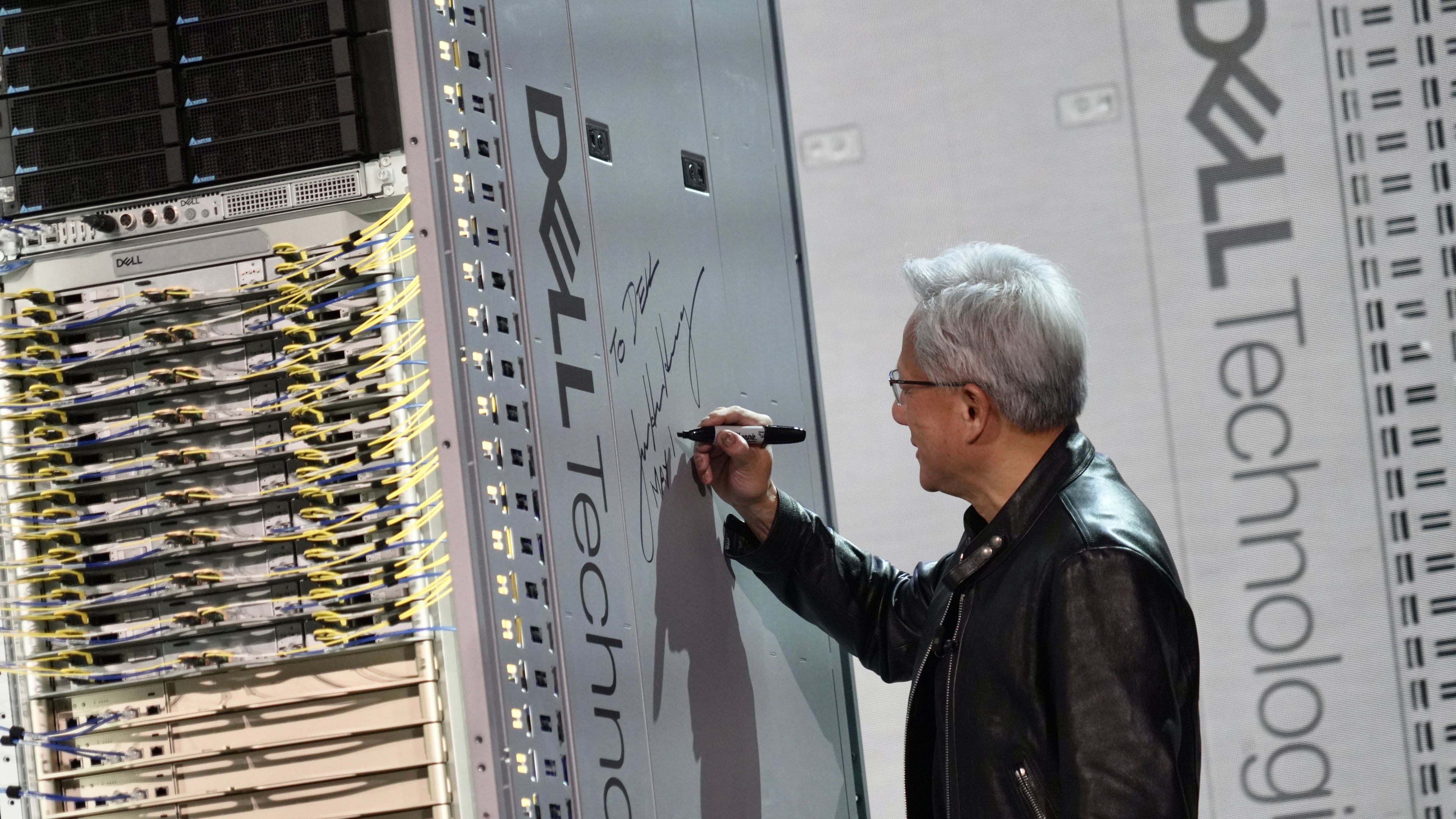 CEO of NVIDIA Jensen Huang signs a DELL machine at Dell Technologies World event happing in Las Vegas on Monday, May 18, 2026 (AP Phot/Ty ONeil)