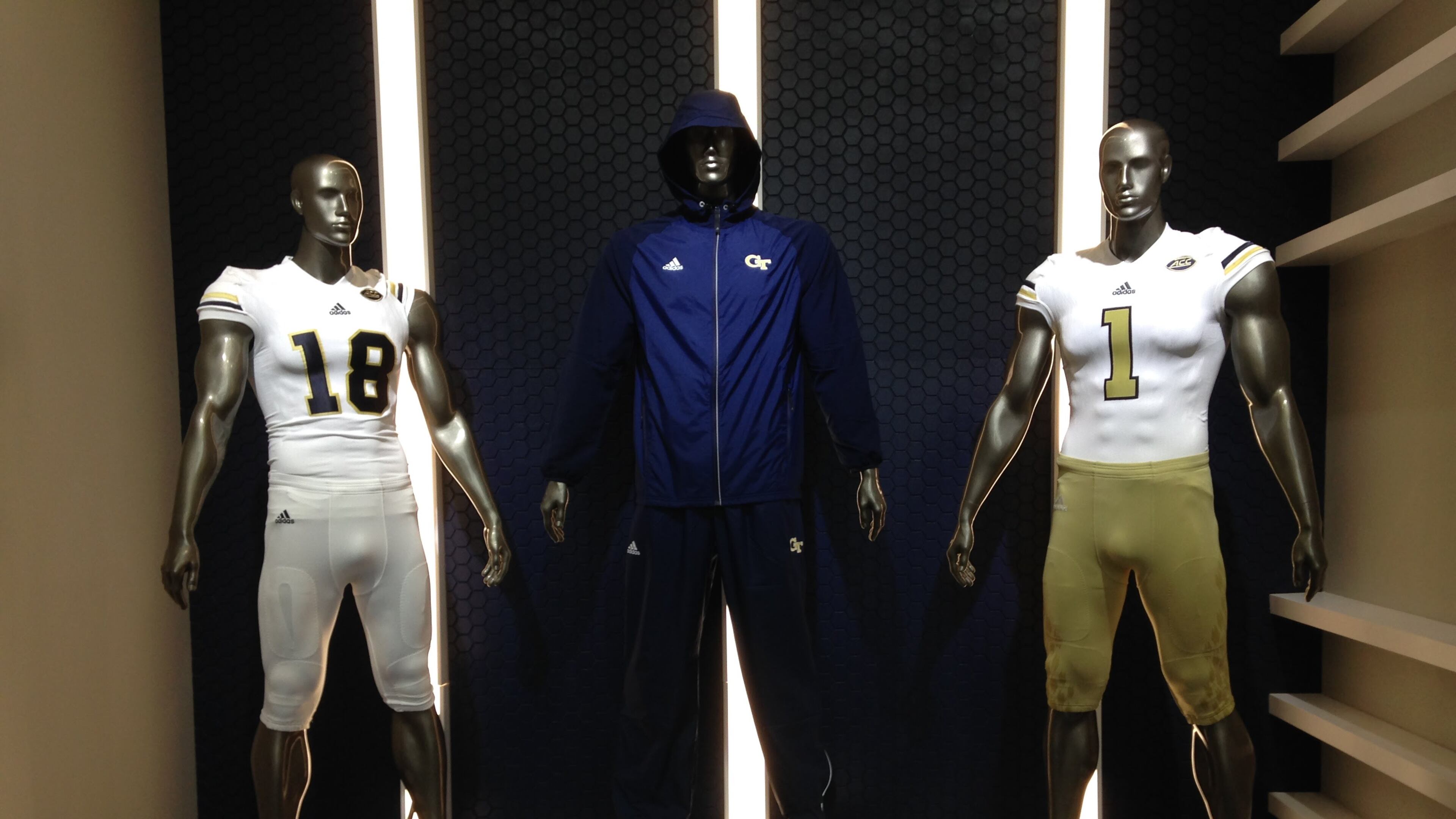 Mannequins in the Georgia Tech football lobby model mock-ups of the Yellow Jackets' uniforms from Adidas. The actual uniforms will be rolled out this spring, athletic director Todd Stansbury said.