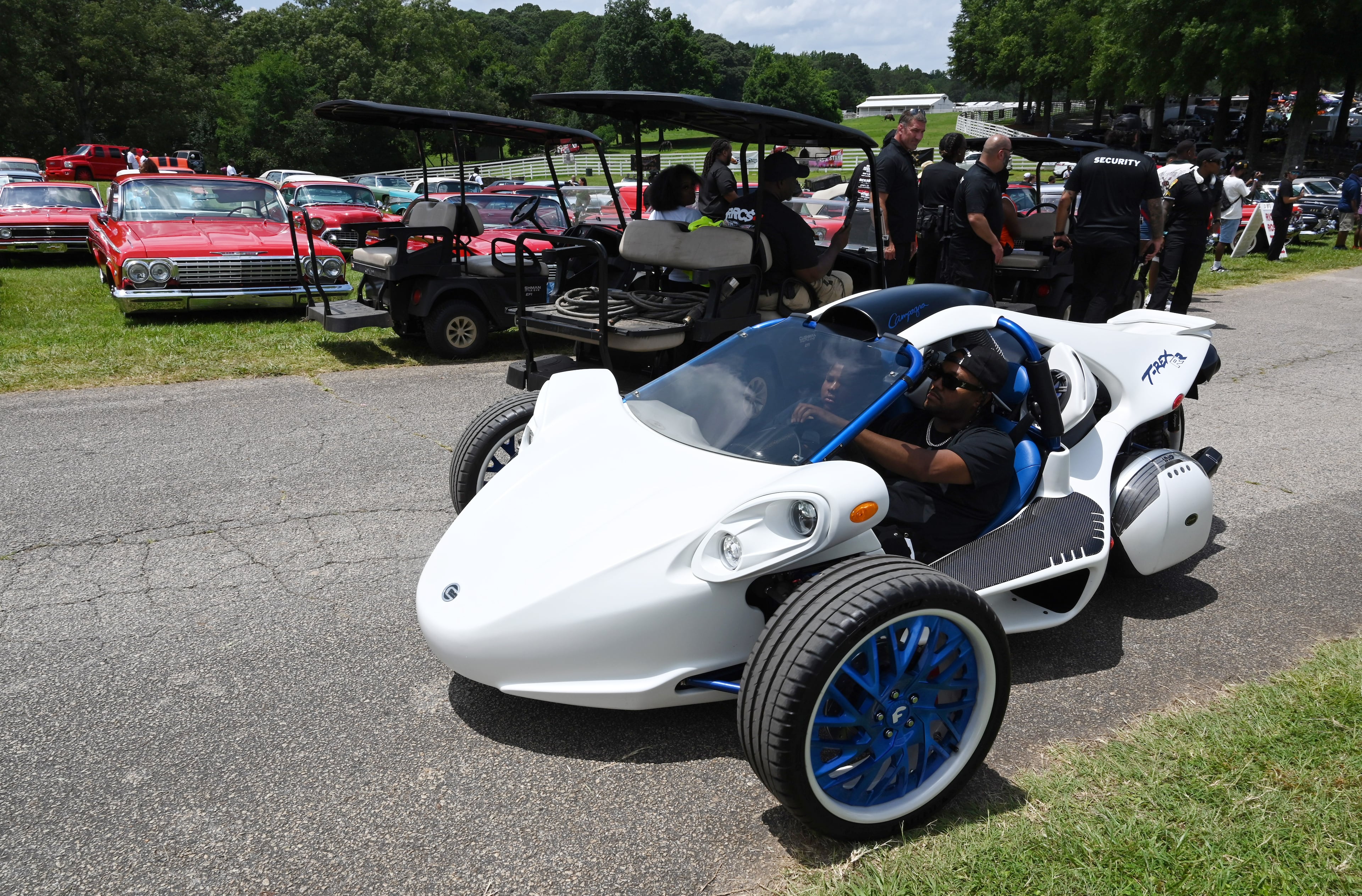 An attendee drives his unique vehicle during the 4th Annual Rick Ross Car and Bike Show, Saturday, June 7, 2025, in Fayetteville. The 4th Annual Rick Ross Car and Bike Show will include a vendor market with more than 30 vendors, food trucks, fleets of classic/custom automobiles, luxury vehicles, boats, RVs and trailers on the front of the mansion. Stage performances include Plies, Ross' new signee Nino Breeze and Ross himself. (Hyosub Shin / AJC)