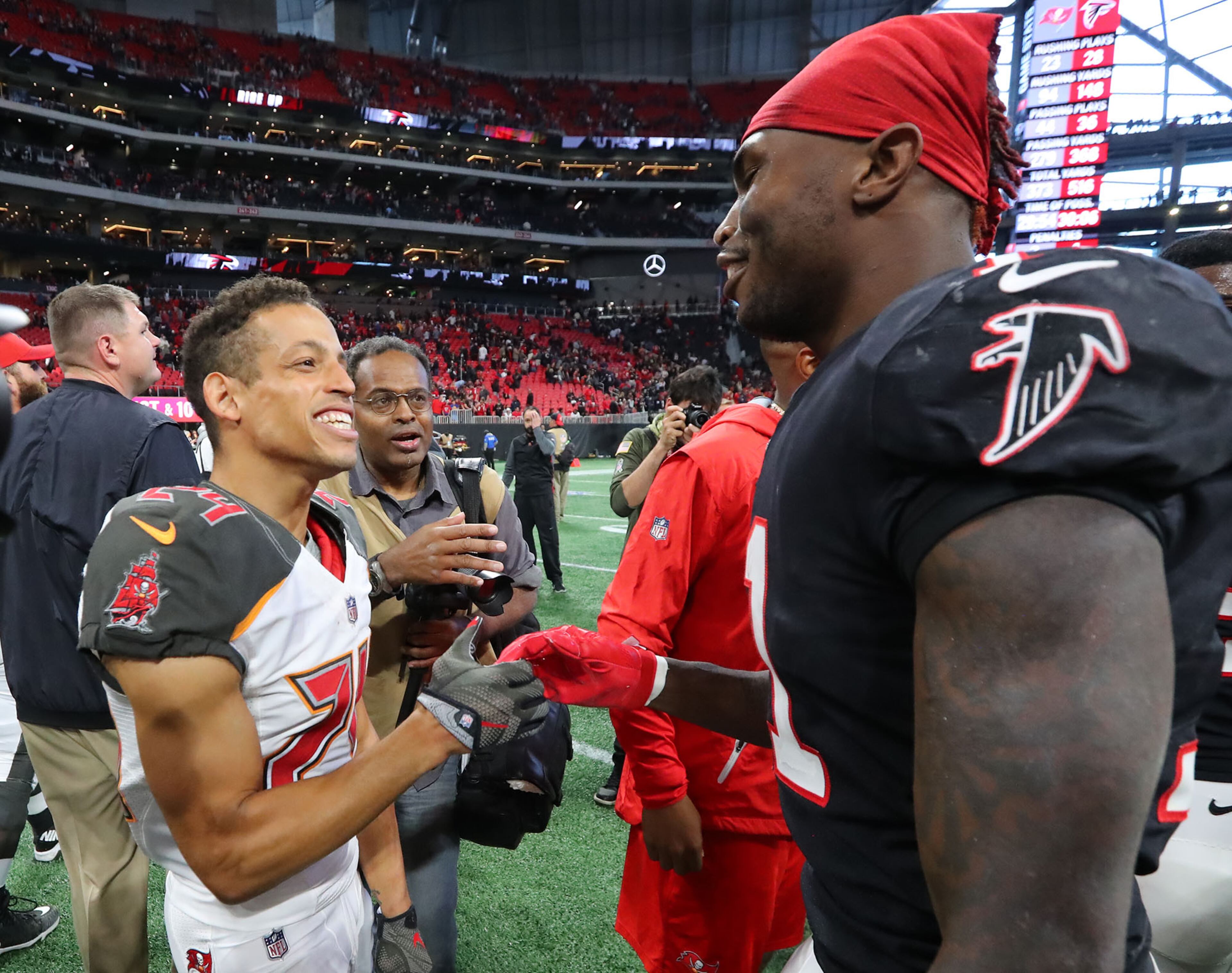 November 26, 2017 Atlanta: Falcons wide receiver Julio Jones greets former teammate Brent Grimes after beating the Buccaneers 34-20 in a NFL football game on Sunday, November 26, 2017, in Atlanta. Curtis Compton/ccompton@ajc.com