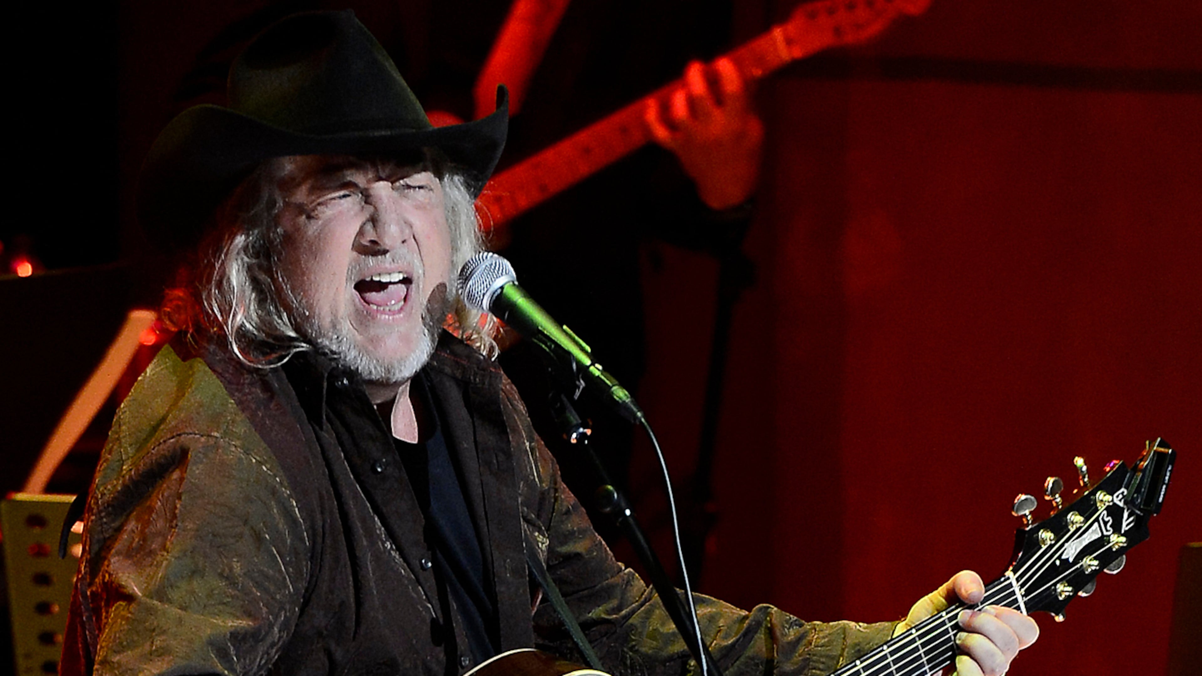 FILE - John Anderson performs at the ceremony for the 2013 inductions into the Country Music Hall of Fame in Nashville, Tenn., on Oct. 27, 2013. (AP Photo/Mark Zaleski, File)