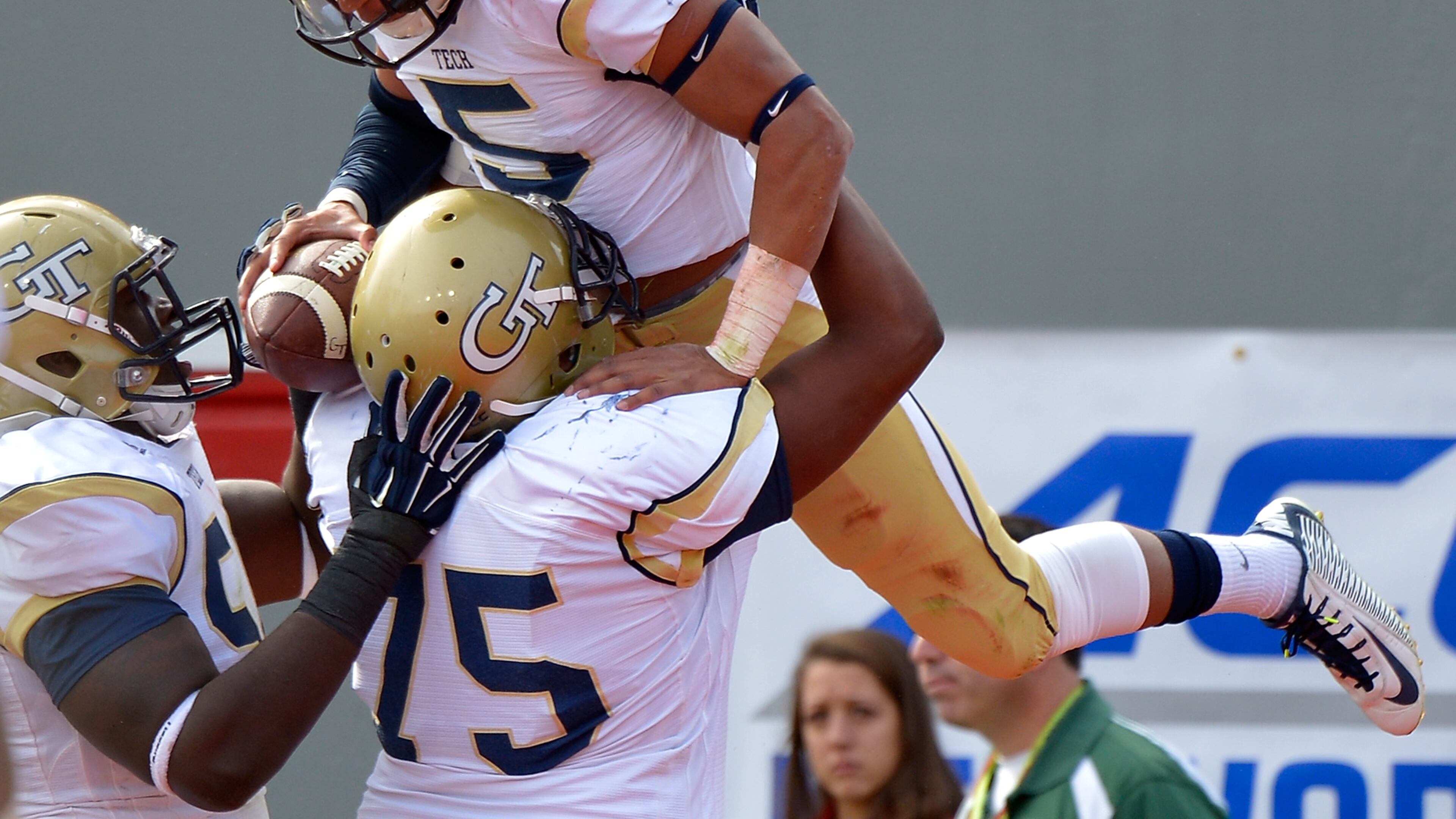 RALEIGH, NC - NOVEMBER 08: Justin Thomas #5 celebrates with teammates after scoring a touchdown against the North Carolina State Wolfpack during their game at Carter-Finley Stadium on November 8, 2014 in Raleigh, North Carolina. (Photo by Grant Halverson/Getty Images) Georgia Tech quarterback Justin Thomas is the pilot of the most efficient offense in the country, by judgment of Football Outsiders. (GETTY IMAGES)