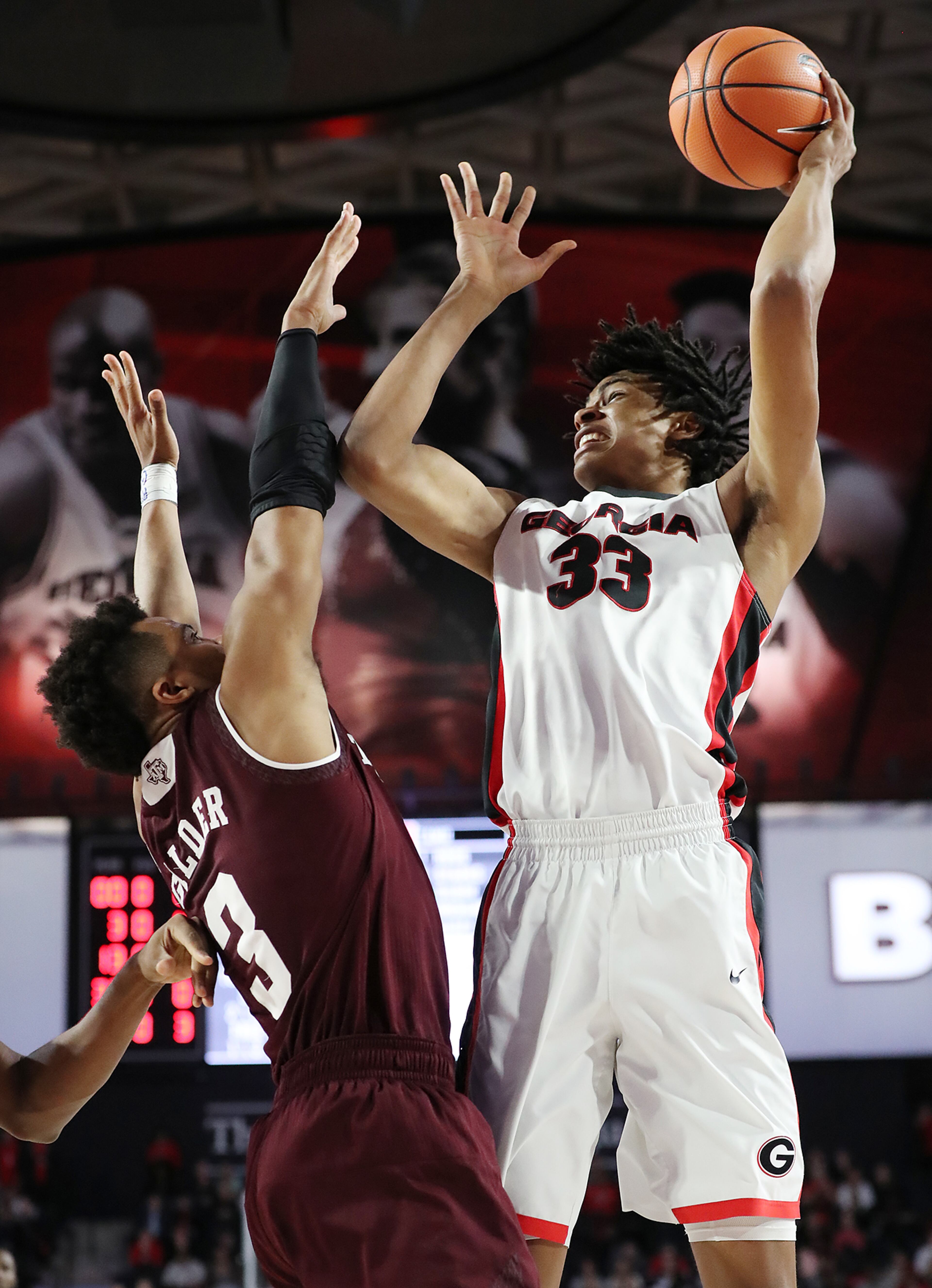 Feb 28, 2018 Athens: Georgia forward Nicolas Claxton shoots for two over Texas A&M guard Adam Gilder in their NCAA college basketball game on Wednesday, Feb 28, 2018, in Athens. Curtis Compton/ccompton@ajc.com