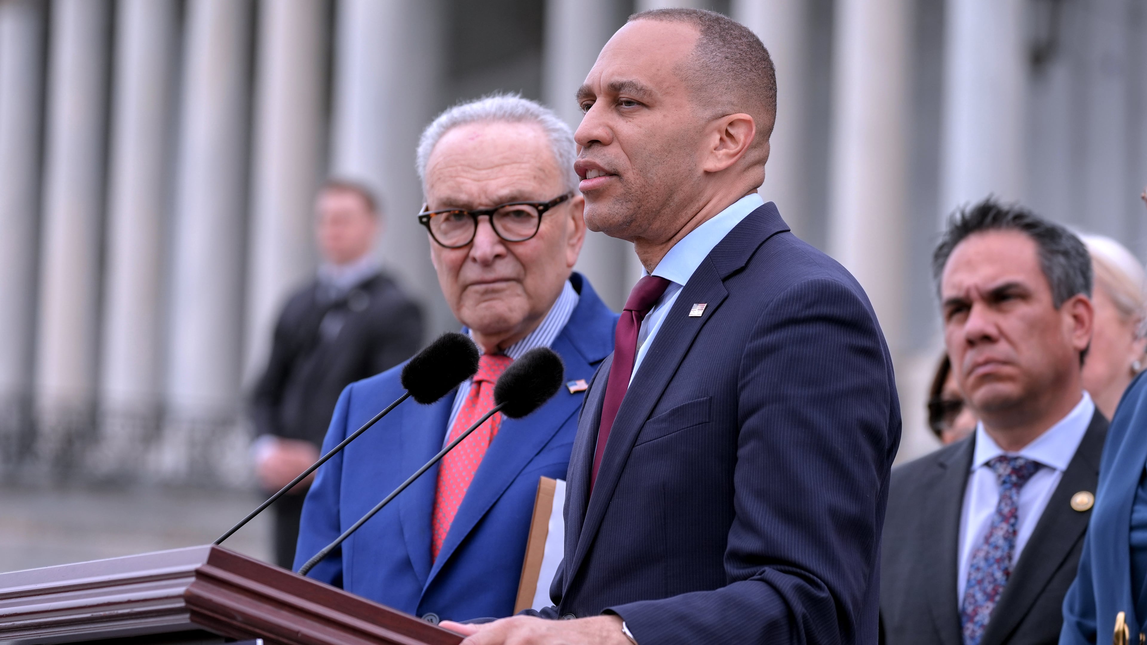 House Minority Leader Hakeem Jeffries, D-N.Y., center, speaks as Senate Minority Leader Chuck Schumer, D-N.Y., left, Vice Chair Rep. Pete Aguilar, D-Calif., right, listen during a news conference, Thursday, May 21, 2026, on Capitol Hill, in Washington. (AP Photo/Mariam Zuhaib)