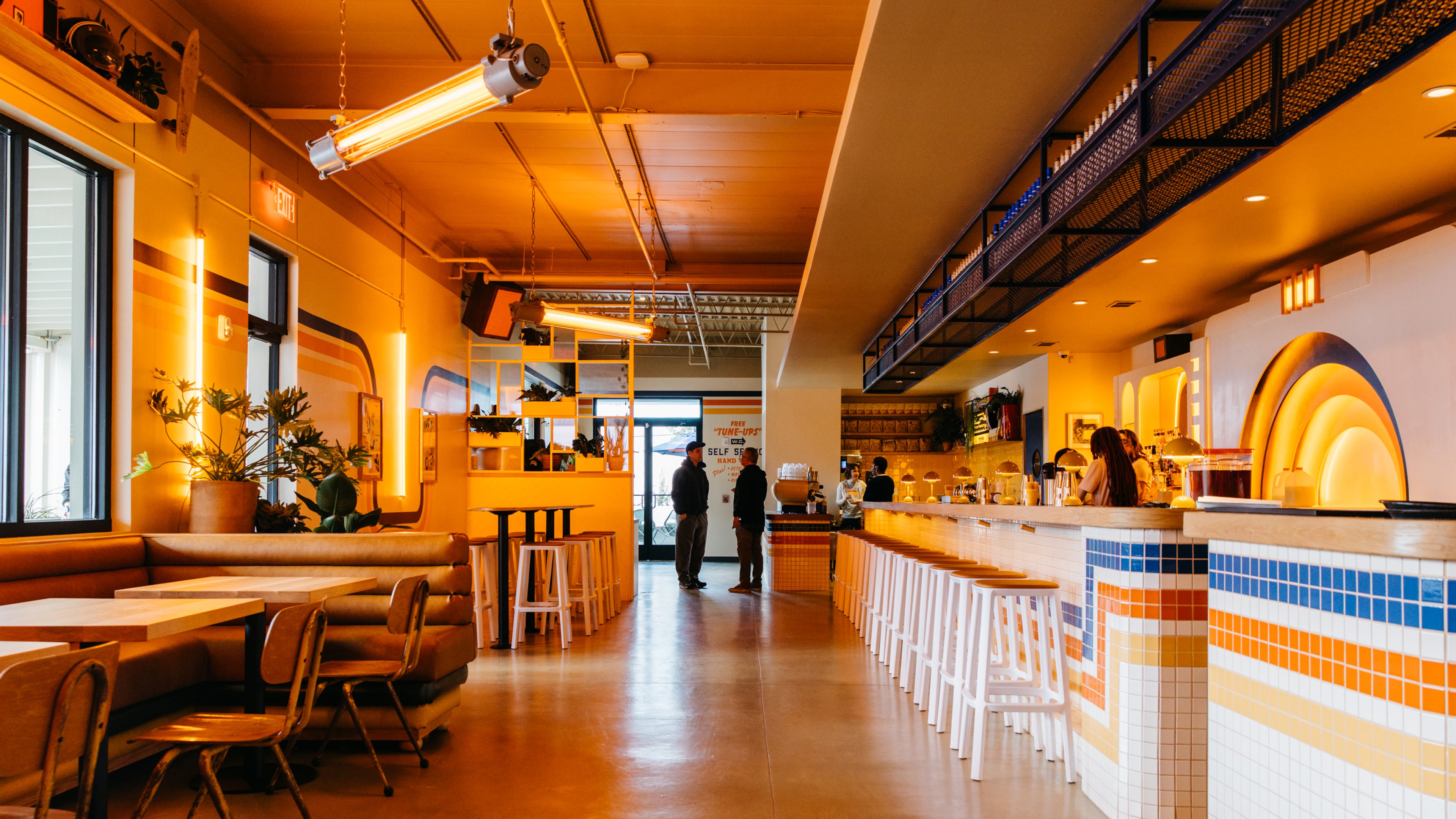 The interior of Muchacho leans into the bright, orange, retro styling. (Courtesy of Luke Beard/Muchacho)