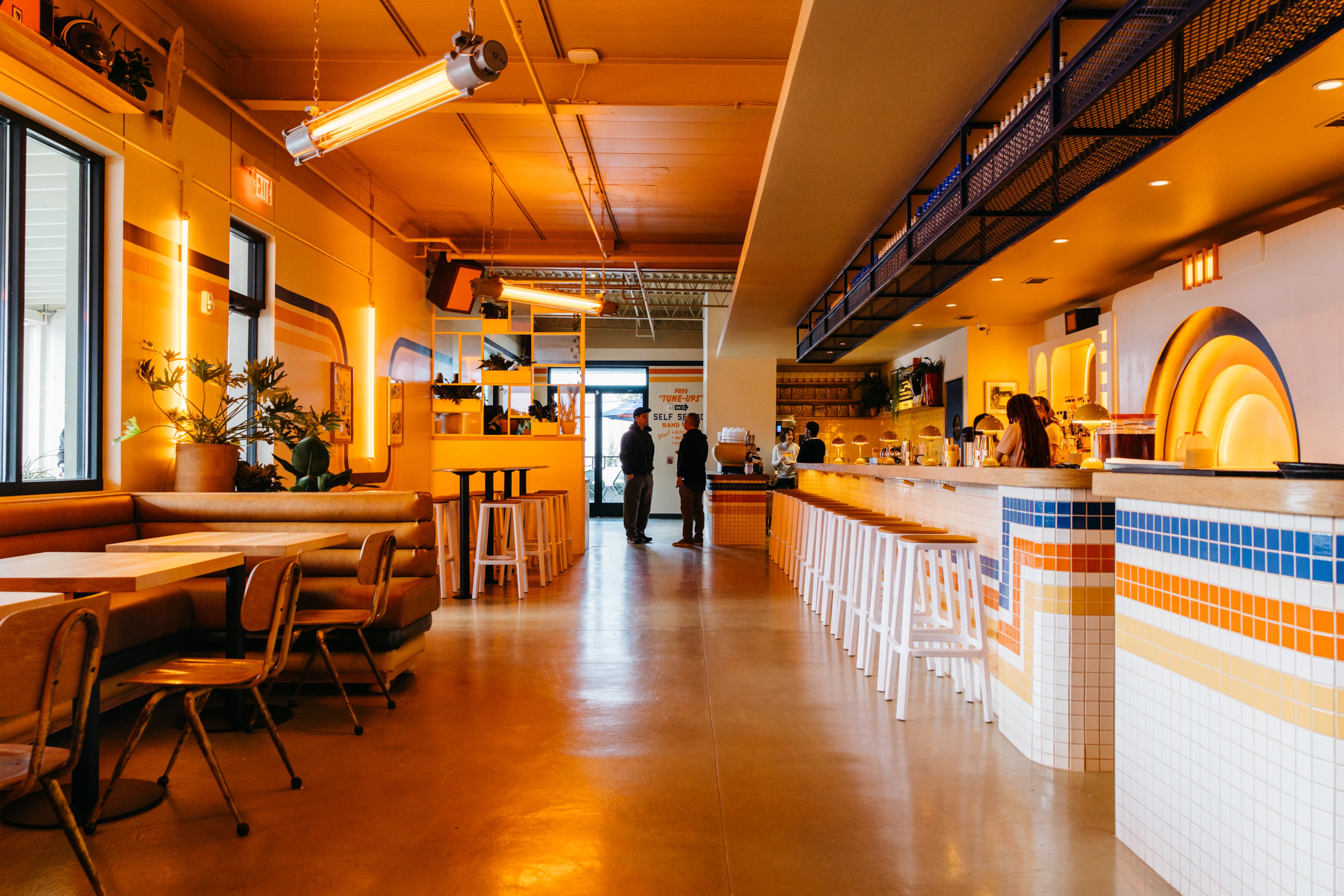The interior of Muchacho leans into the bright, orange, retro styling. (Courtesy of Luke Beard/Muchacho)