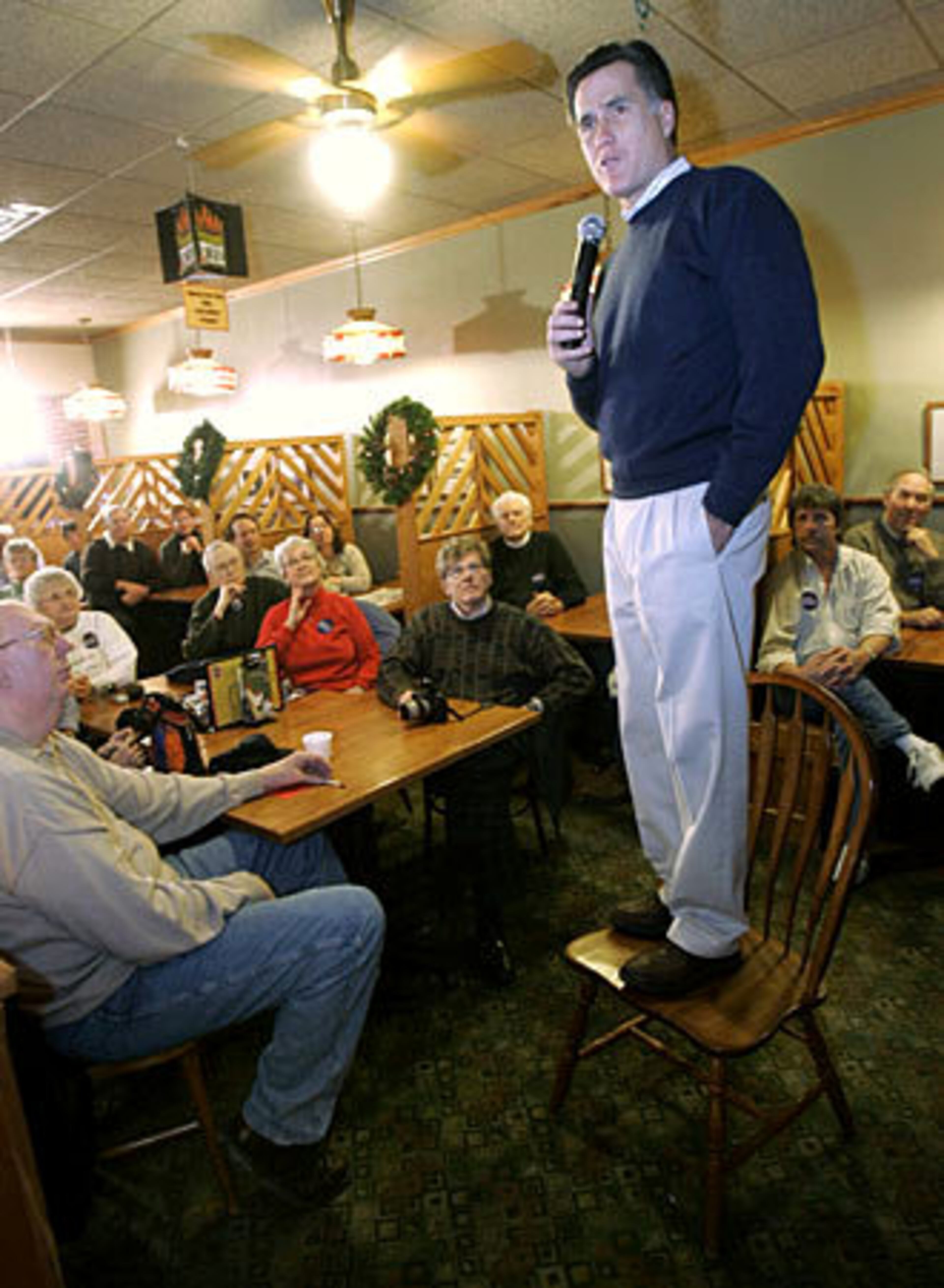 Republican presidential hopeful and former Massachusetts Gov. Mitt Romney speaks Momday at a campaign stop at Happy Joe's Pizza and Ice Cream in Clinton, Iowa.