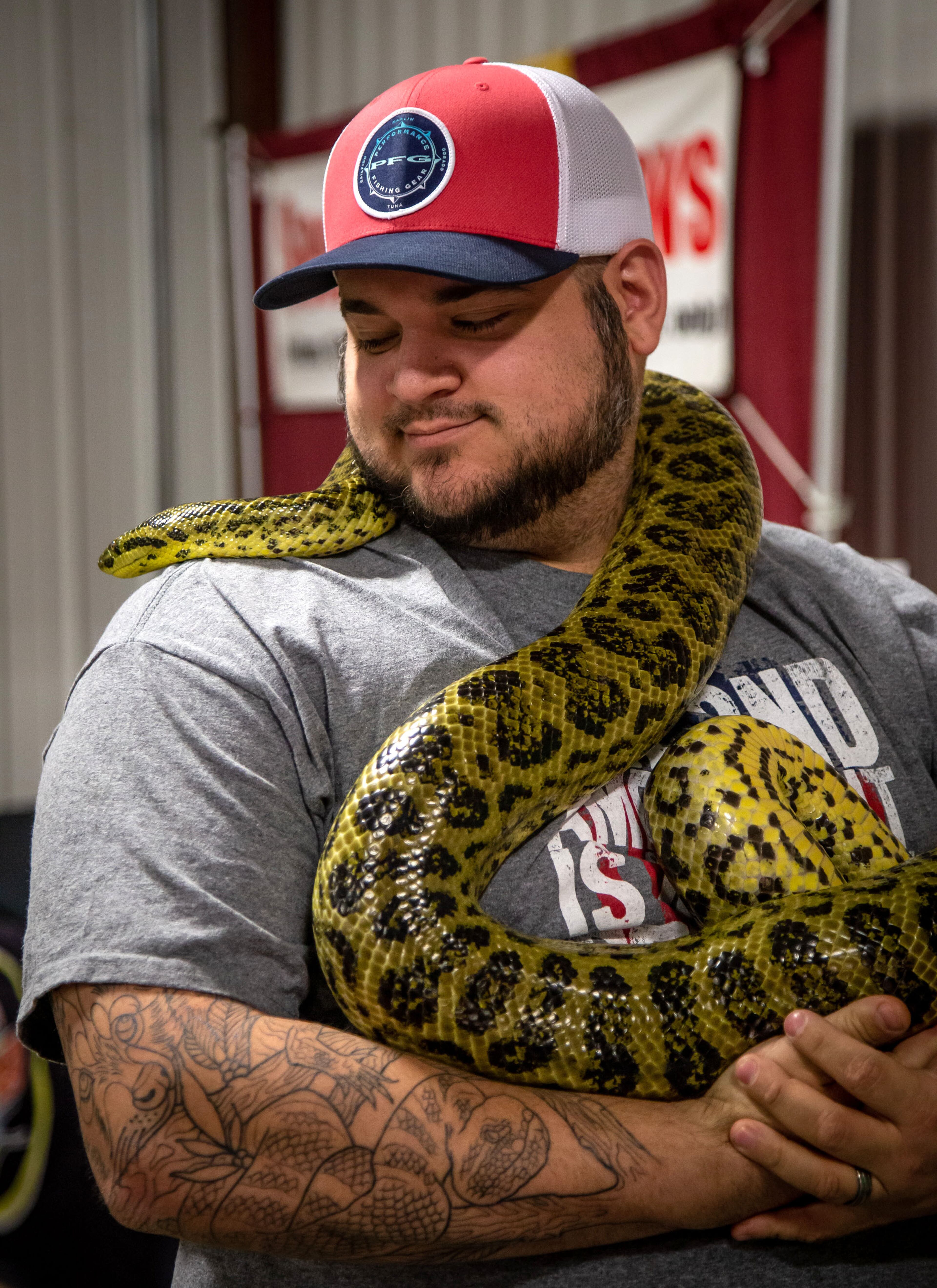 Jake Nowell holds his yellow anaconda snake during Repticon at the Gwinnett County Fairgrounds on Sunday, January 5, 2020. STEVE SCHAEFER / SPECIAL TO THE AJC