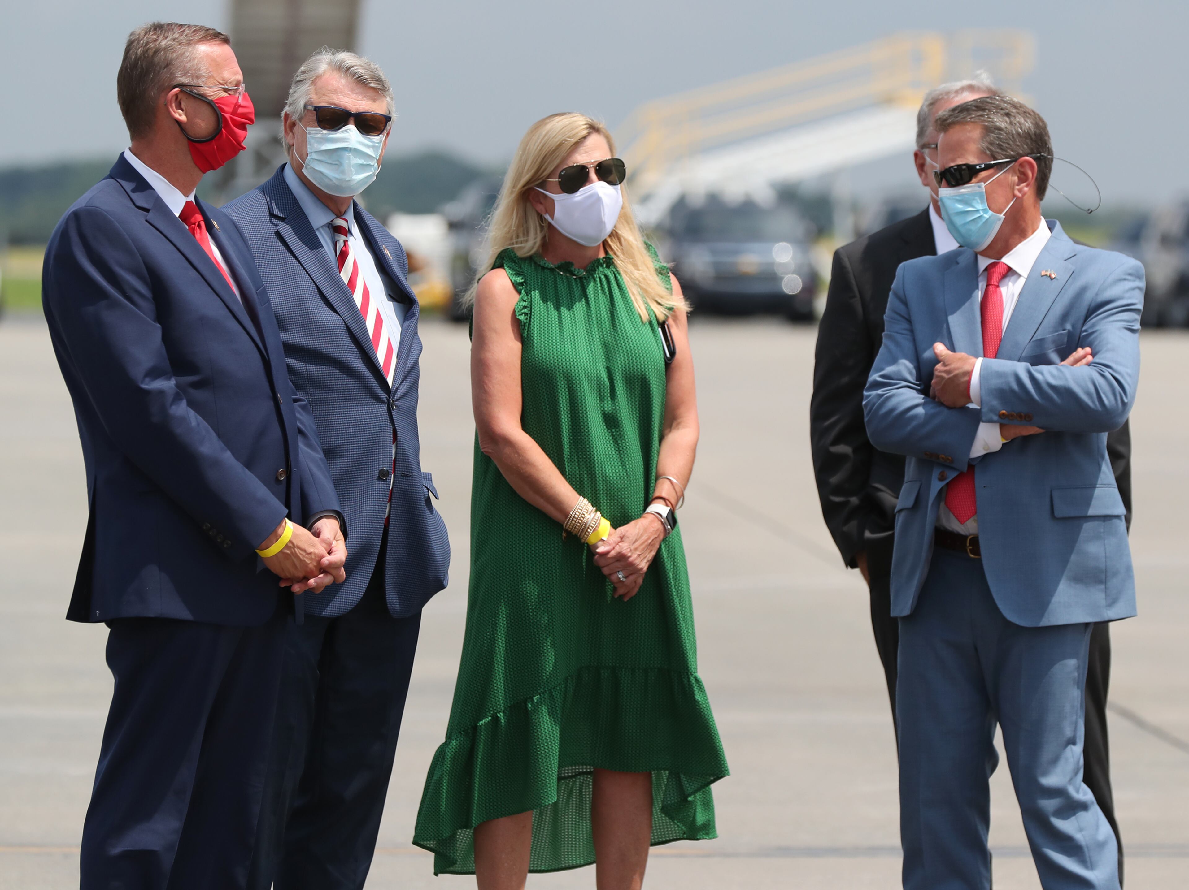 071520 Atlanta: Congressman Doug Collins (far left) speaks with Georgia Governor Brian Kemp (far right) while waiting for President Donald Trump to arrive for his Georgia visit to talk about an infrastructure overhaul at the UPS Hapeville hub at Hartsfield-Jackson International Airport on Wednesday July 15, 2020 in Atlanta. Curtis Compton ccompton@ajc.com