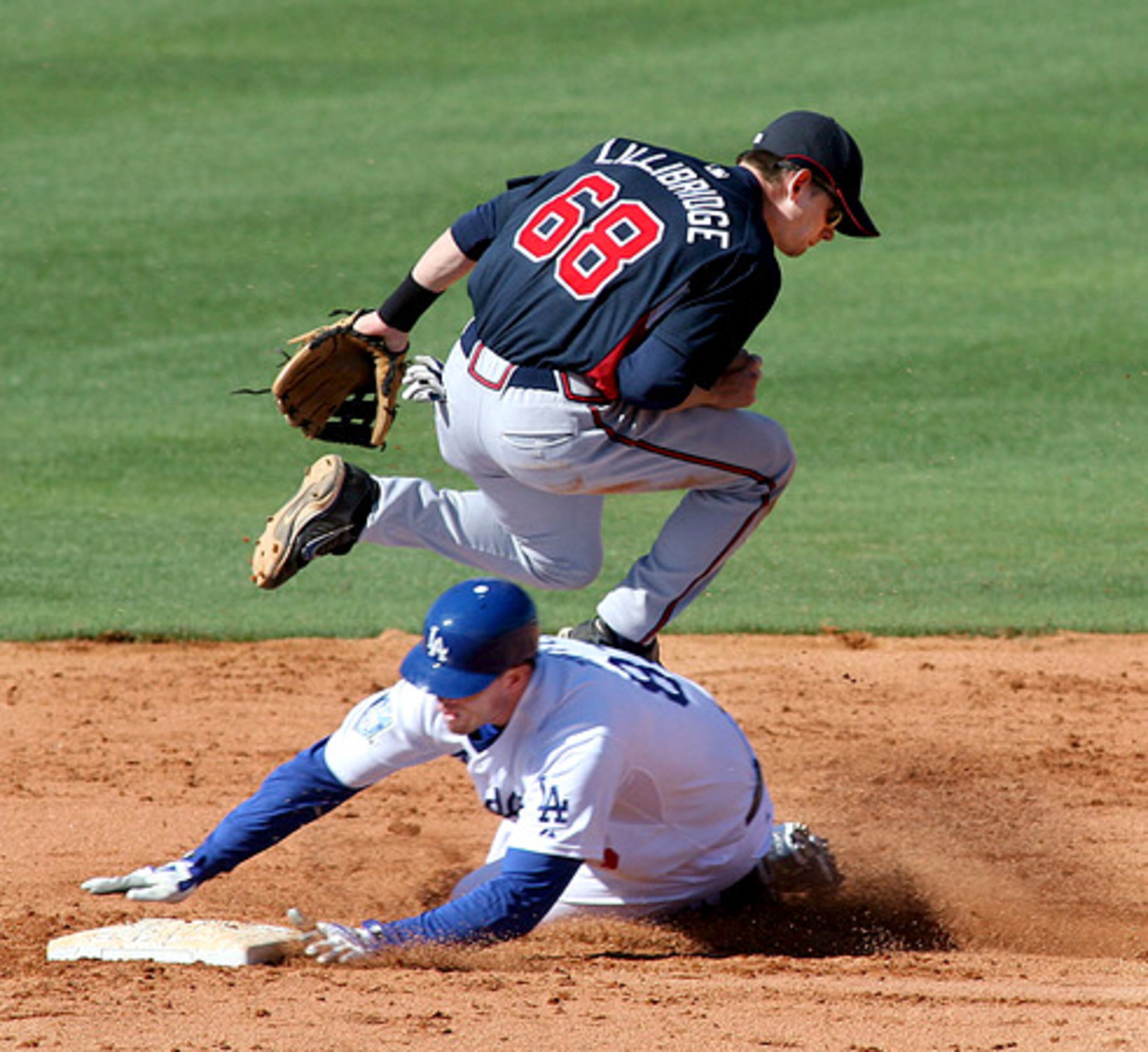 The Dodgers' Terry Tiffee is tagged out by a jumping Brent Lillibridge at second to end the 8th with a double play. Tiffee and Lillibridge are non-roster invitees to their club.