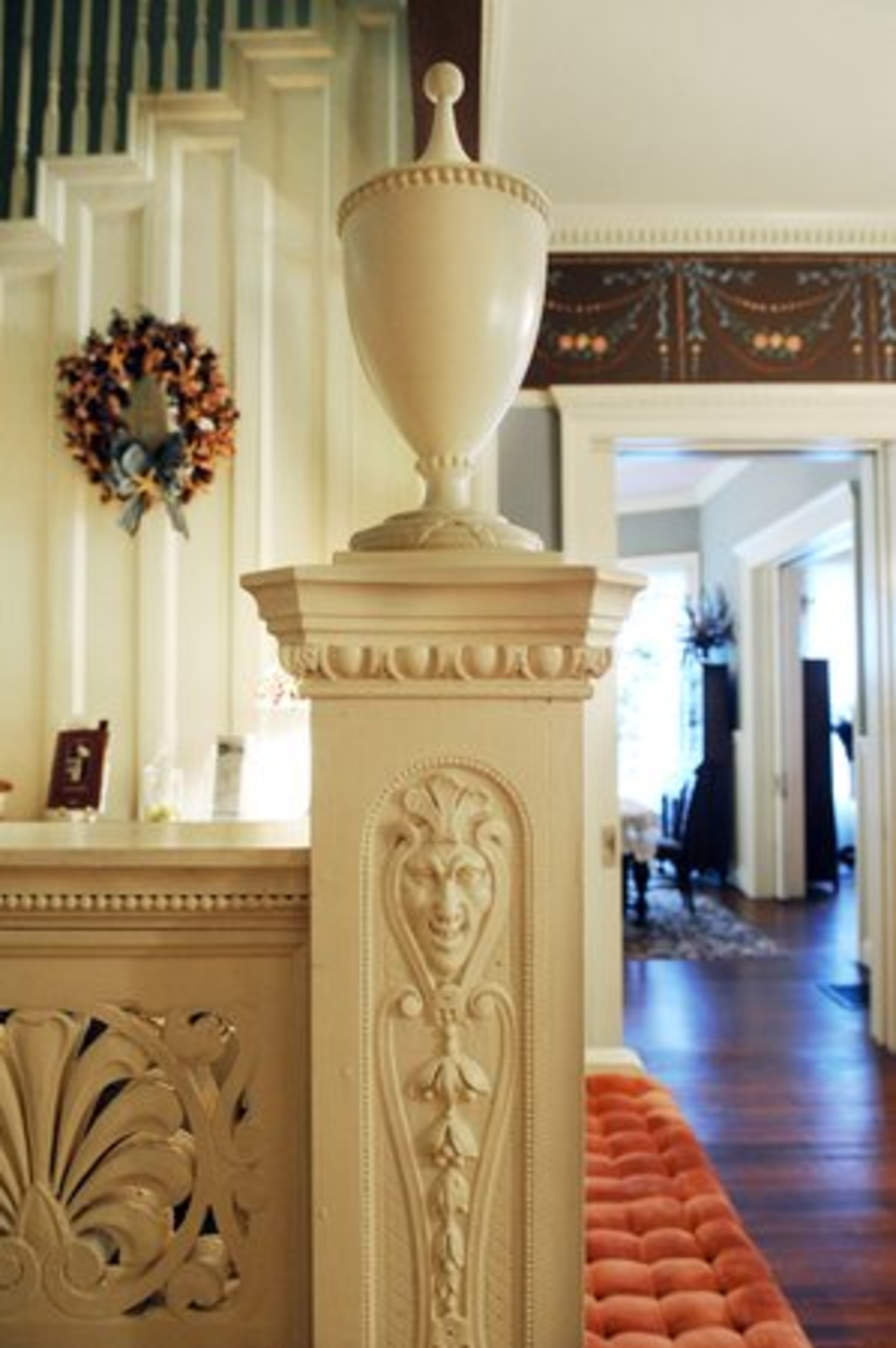 The carving on the newell post was thought to keep 'evil spirits' from going upstairs.