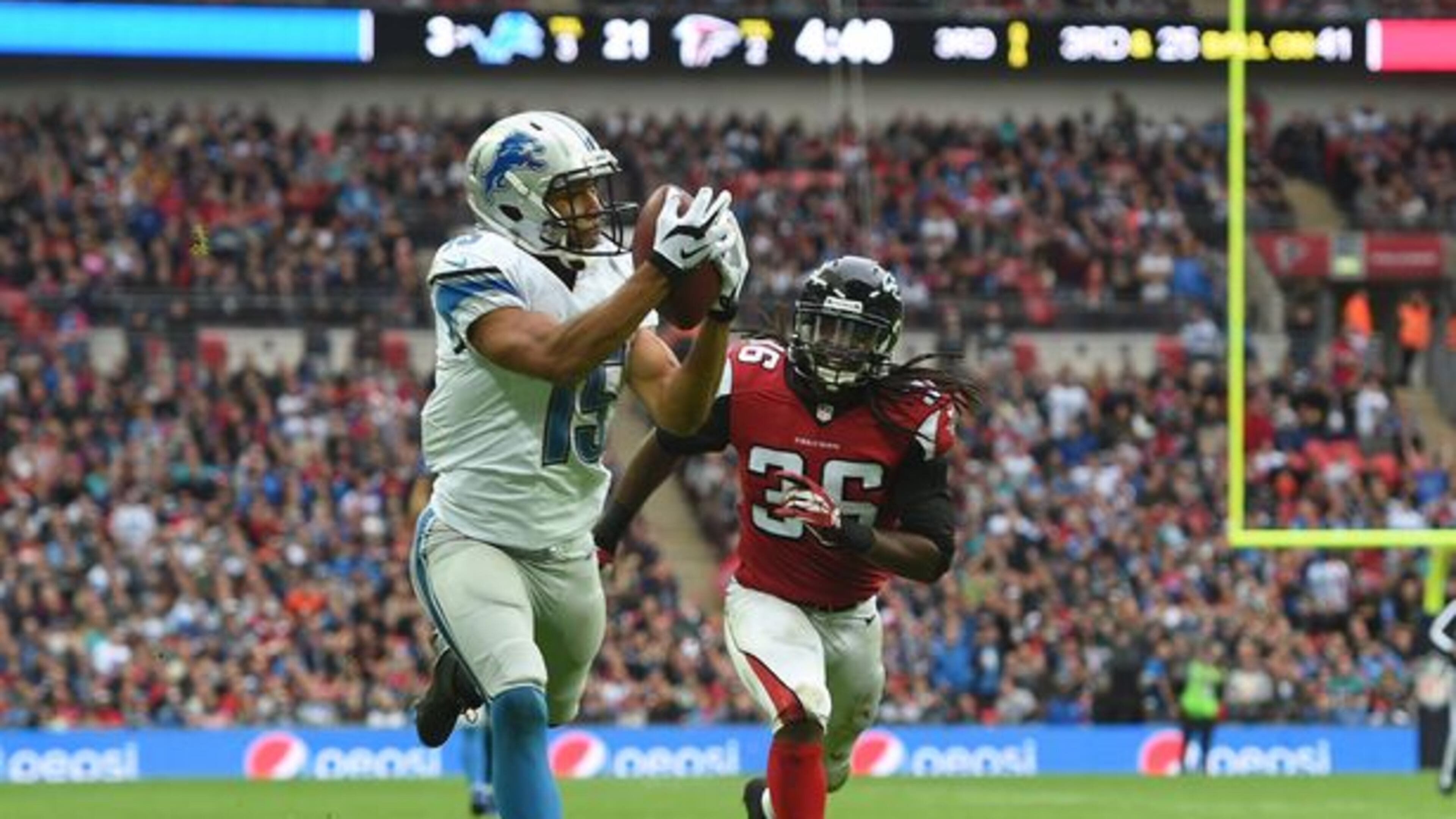 Tim Ireland Detroit Lions wide receiver Golden Tate (15) catches the ball to score a touchdown during the NFL football game against Atlanta Falcons at Wembley Stadium, London, Sunday, Oct. 26, 2014. (AP Photo/Tim Ireland)