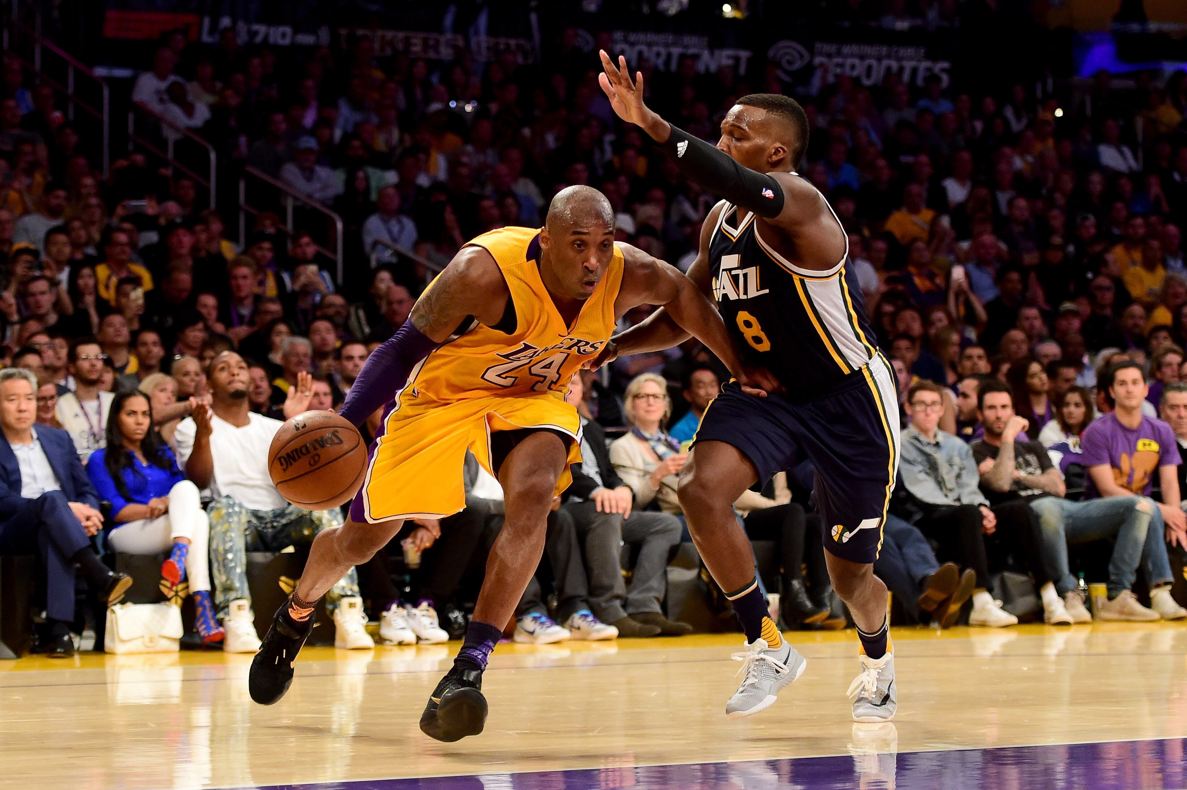 Kobe Bryant #24 of the Los Angeles Lakers drives on Shelvin Mack #8 of the Utah Jazz in the second half at Staples Center on April 13, 2016 in Los Angeles, California. (Photo by Harry How/Getty Images)