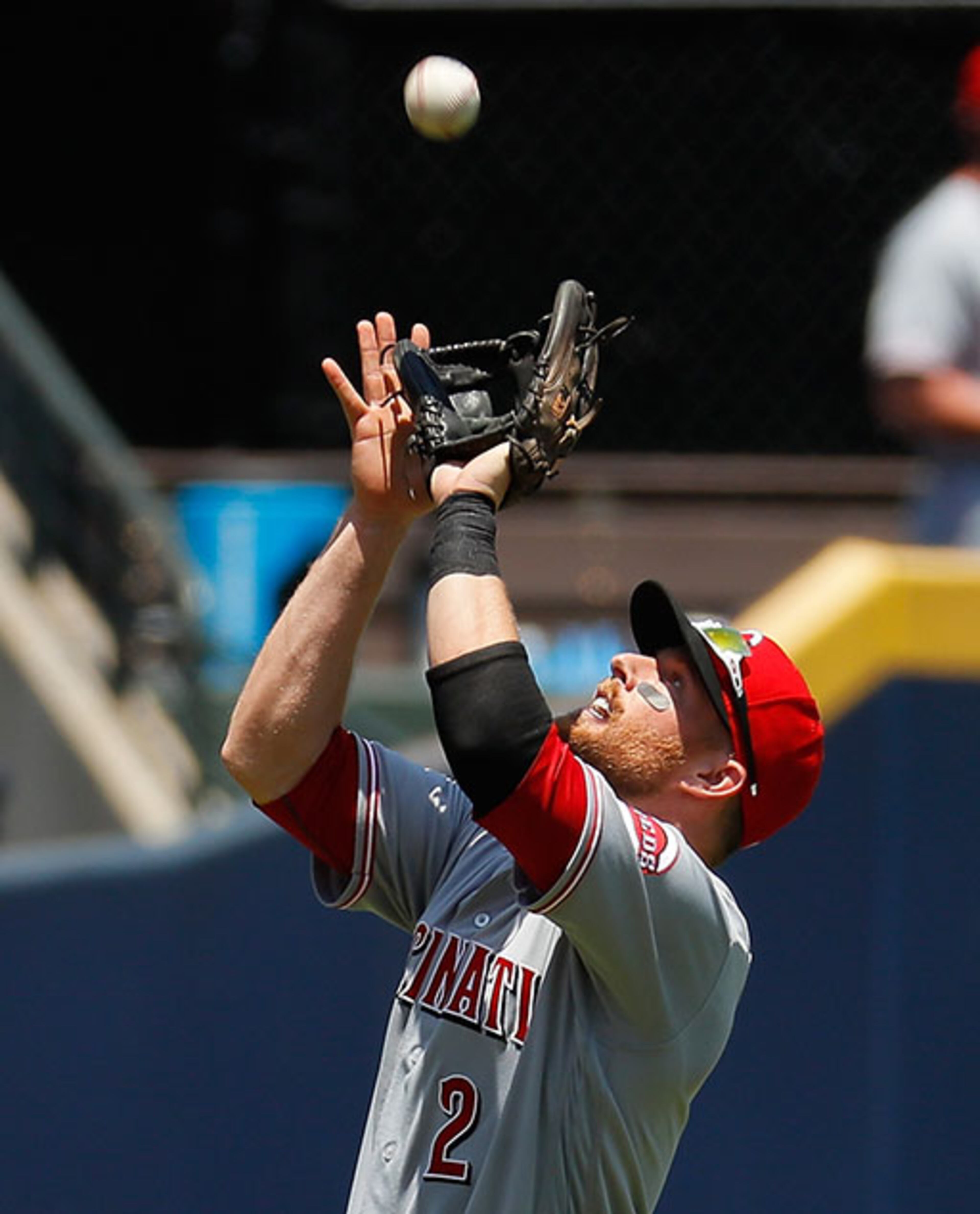 Zack Cozart of the Cincinnati Reds catches a pop up hit by the Braves' Ender Inciarte in the third inning Thursday, June 16, 2016, at Turner Field in Atlanta.