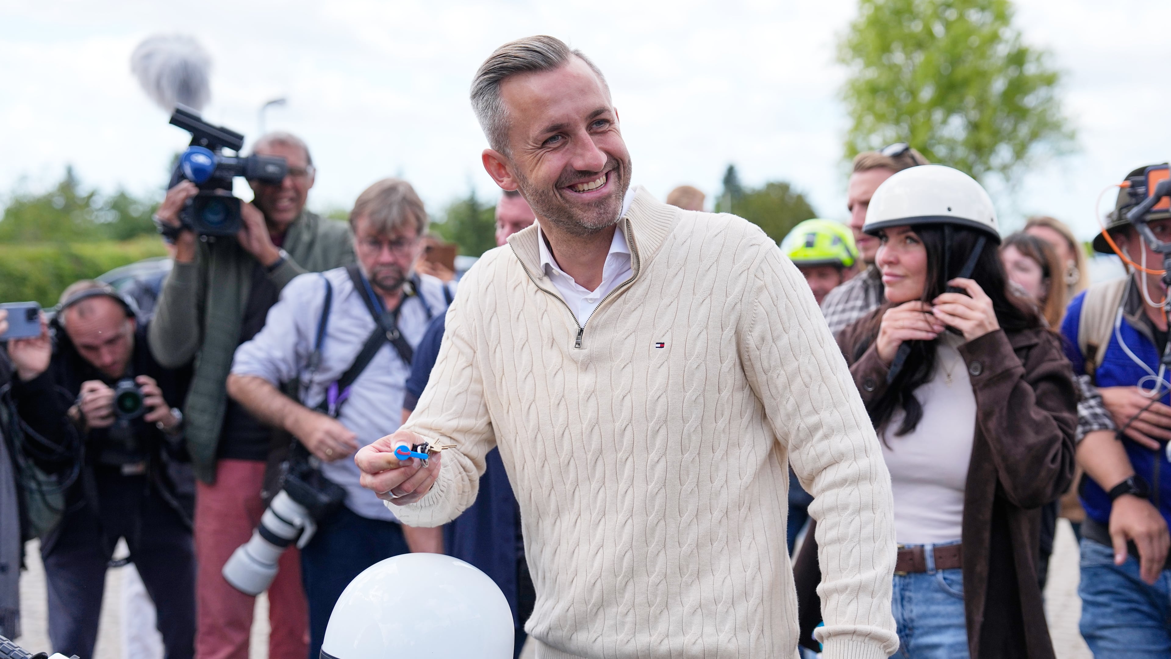 Ulrich Siegmund, top candidate for the "Alternative for Germany" (AfD) party how's his motorcycle keys in party coolers after voting at a polling station during the Saxony-Anhalt state elections in Tangermuende, eastern Germany, Sunday, Sept. 6, 2026. (AP Photo/Matthias Schrader)