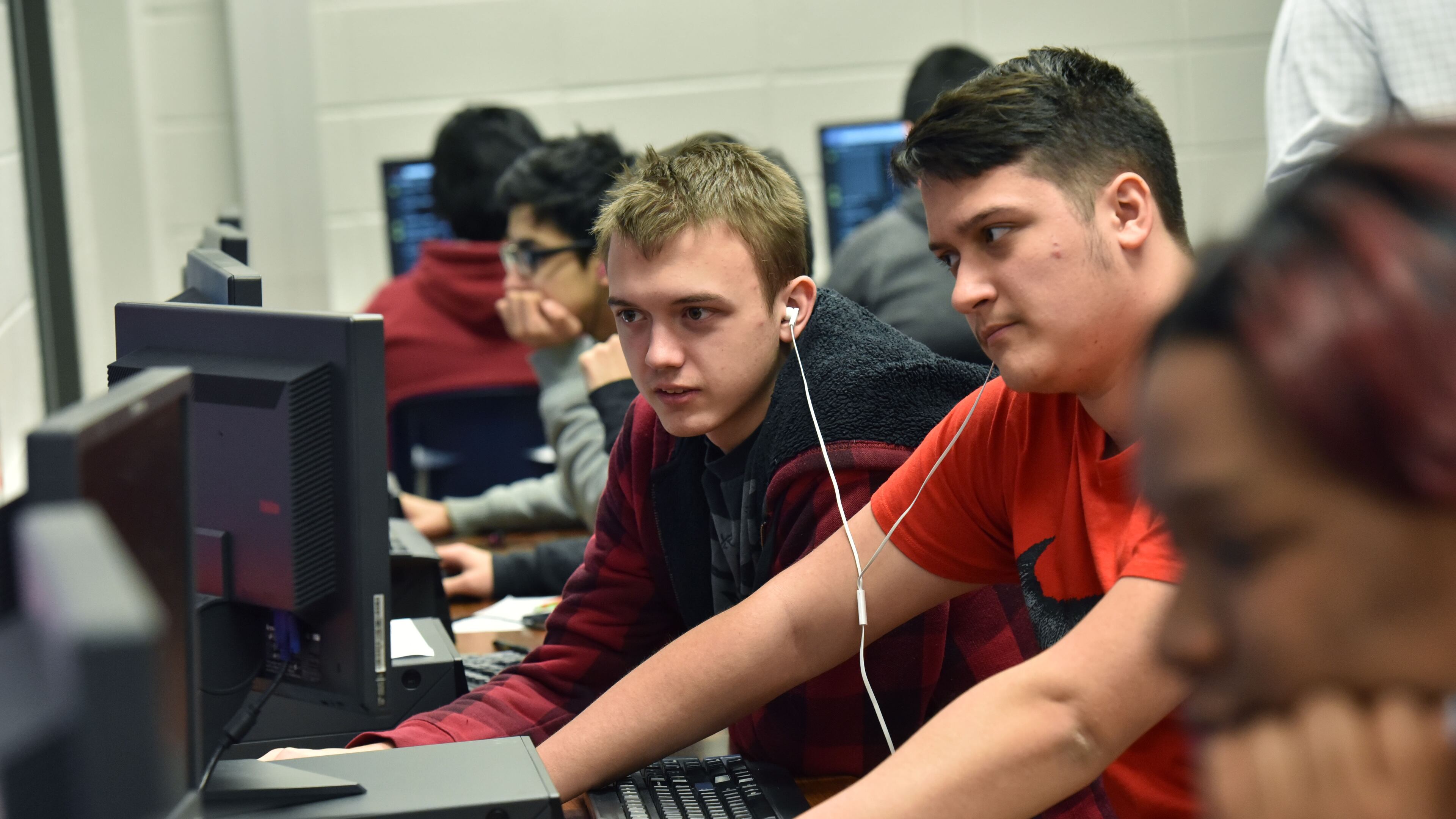 In this March 2017 file photo, Clayton Koffman (center left), 17, and Steve Harris (center right), 18, team up to work on their project during AP Computer Science Principles class at Berkmar High School. HYOSUB SHIN / HSHIN@AJC.COM