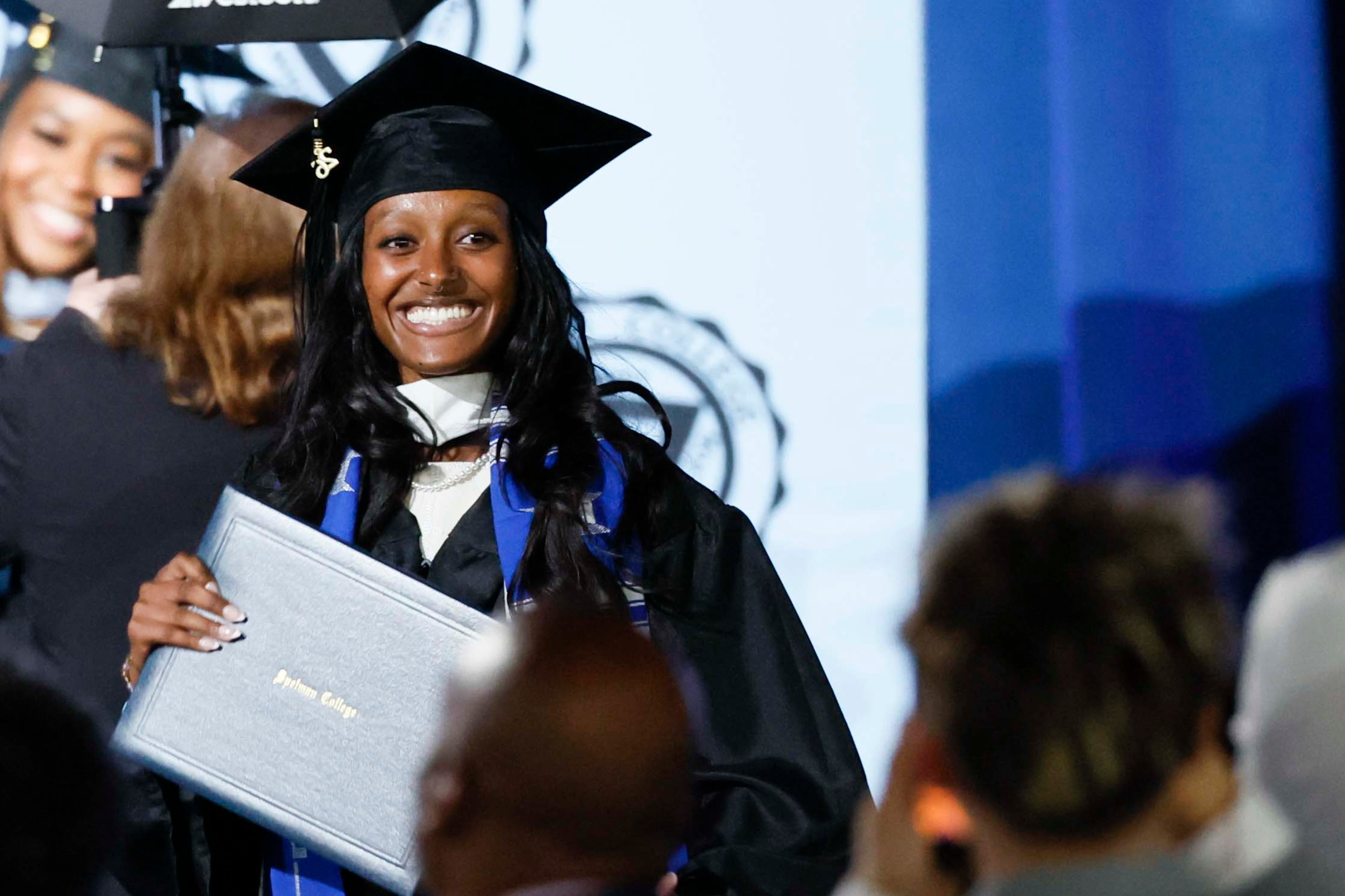 Zahara Marley Jolie-Pitt, the daughter of Angelina Jolie, reacts as she walks off the stage after receiving her diploma during the Spelman College Commencement at the Georgia International Convention Center in College Park on Sunday, May 17, 2026. (Miguel Martinez/AJC)