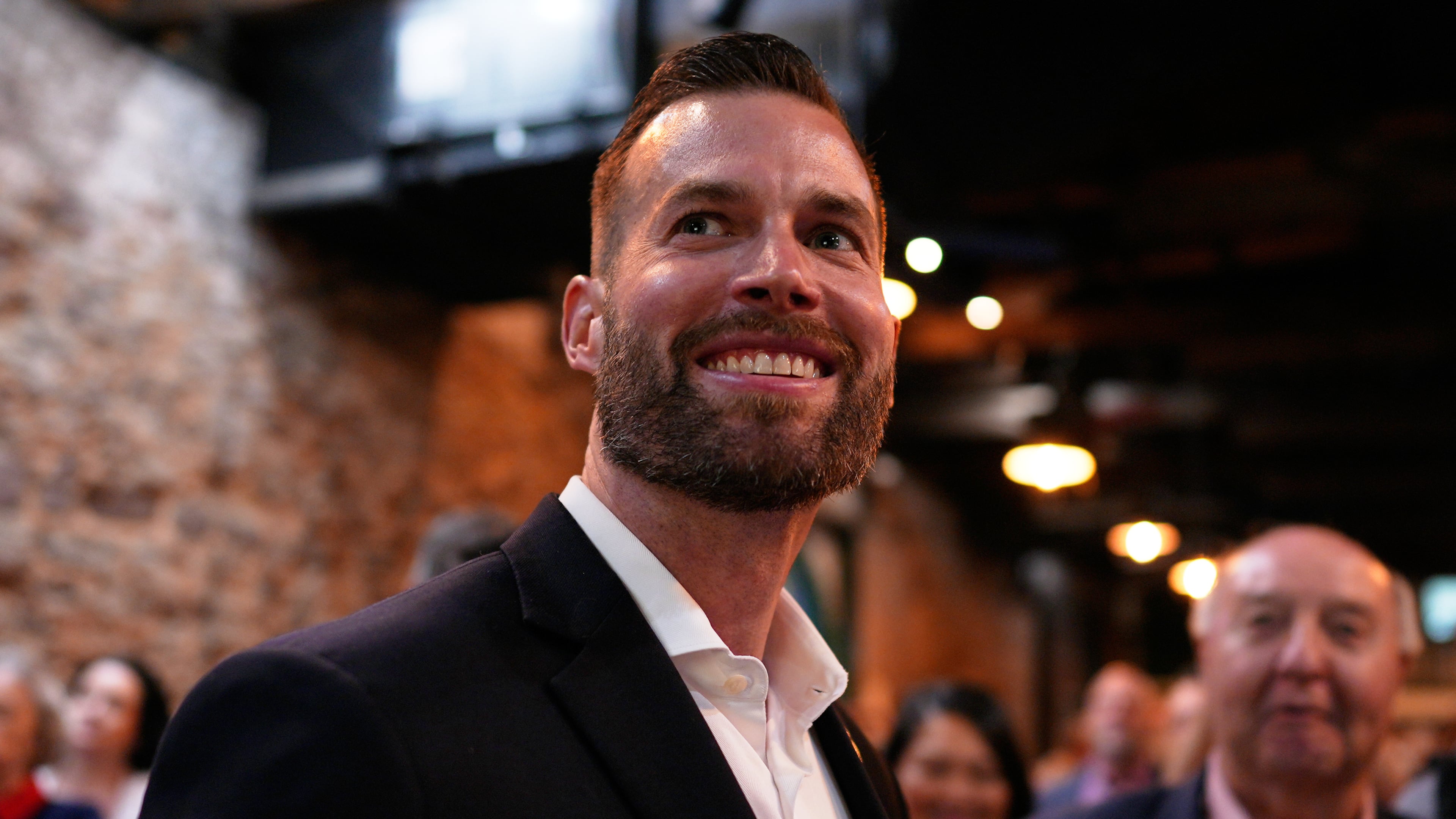 Republican candidate Clay Fuller smiles as election results roll in during an election night watch party, Tuesday, April 7, 2026, in Ringgold, Ga. (AP Photo/Mike Stewart)