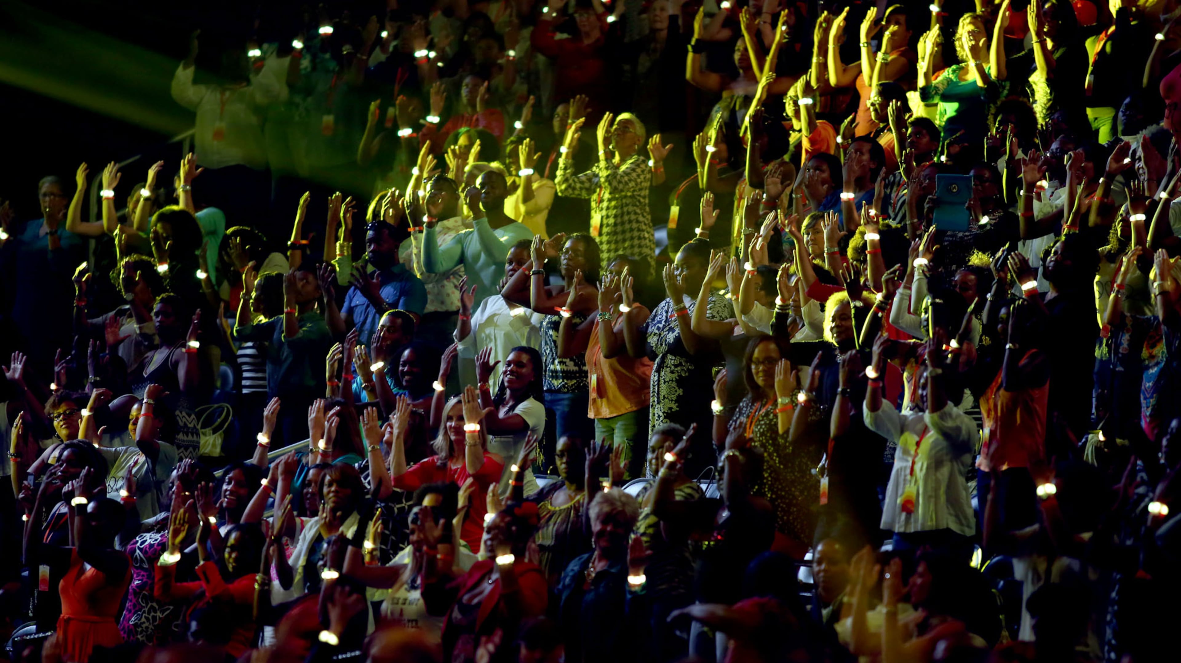 The audience is into the Soul Cycle 15 workout led by trainer Angela Davis at Oprah Winfrey's "The Life You Want Weekend" tour in Atlanta on Saturday, Sept. 6, 2014. (Akili-Casundria Ramsess/Special to the AJC)